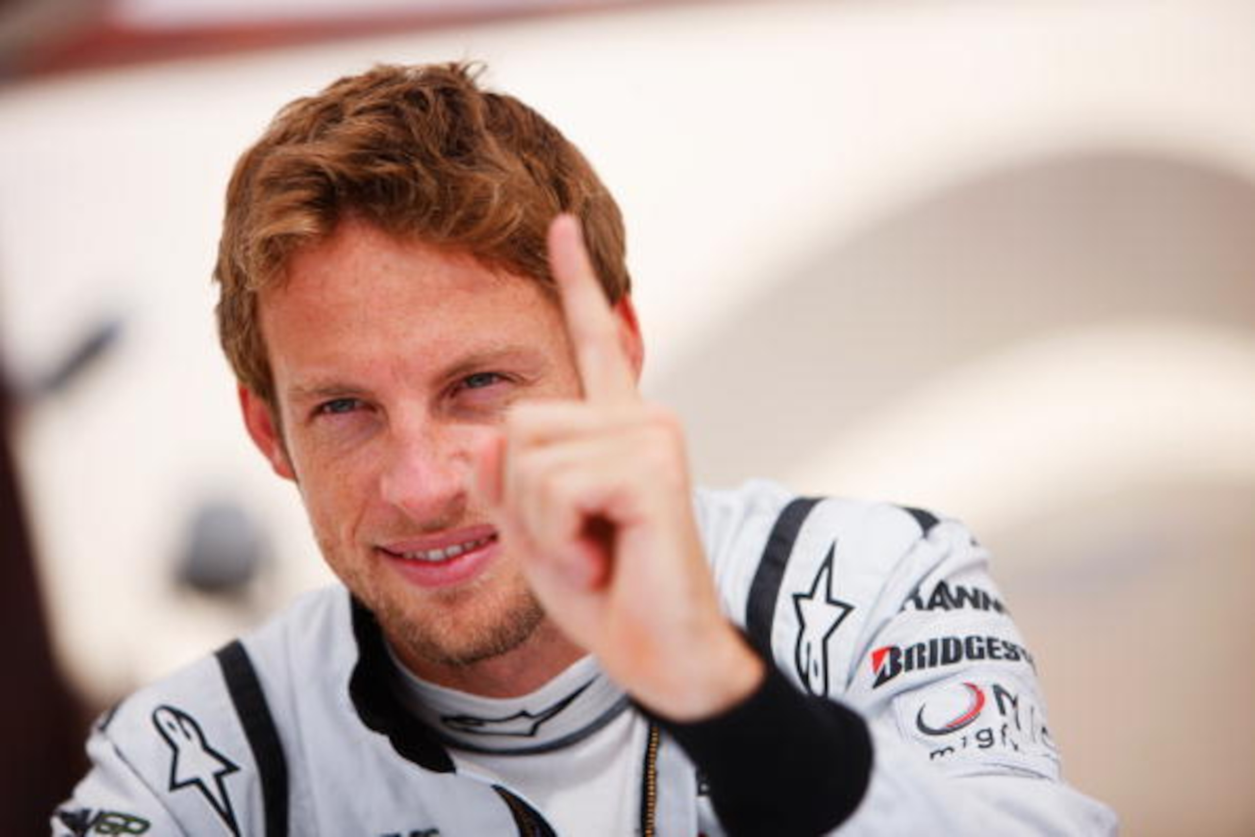 ABU DHABI, UNITED ARAB EMIRATES - OCTOBER 30:  Jenson Button of Great Britain and Brawn GP is seen in the paddock before practice for the Abu Dhabi Formula One Grand Prix at the Yas Marina Circuit on October 30, 2009 in Abu Dhabi, United Arab Emirates.  (