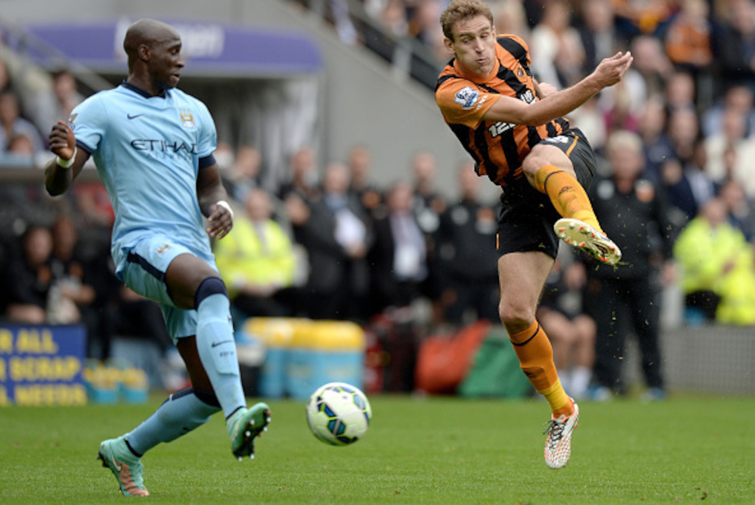 HULL, ENGLAND - SEPTEMBER 27:  Eliaquim Mangala of Manchester City blocks a shot from Nikica Jelevic of Hull City during the Barclays Premier League match between Hull City and Manchester City at KC Stadium on September 27, 2014 in Hull, England.  (Photo 