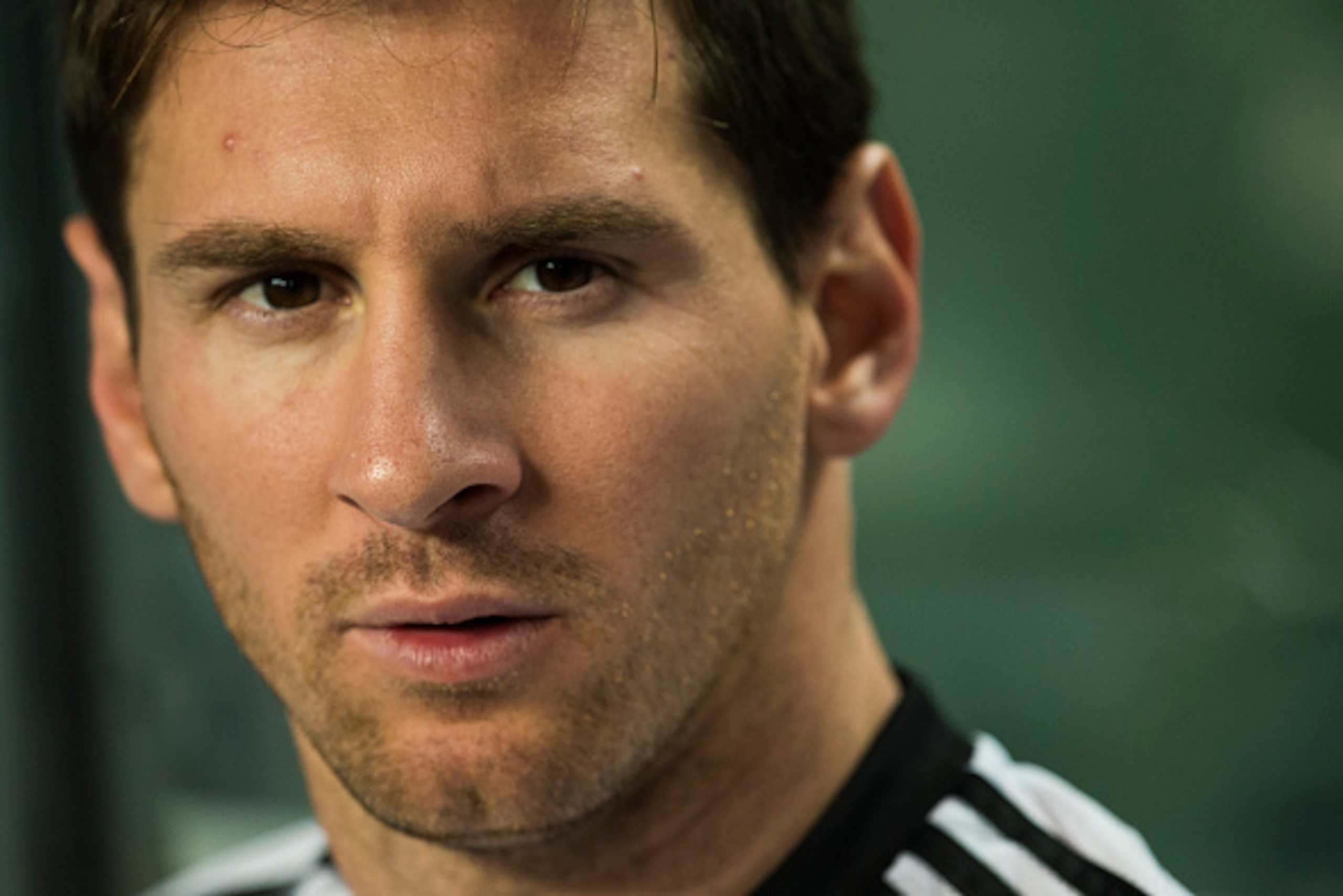 HONG KONG - OCTOBER 14:  Lionel Messi of Argentina sits on the bench prior to the International Friendly Match between Hong Kong and Argentina at the Hong Kong Stadium on October 14, 2014 in Hong Kong, Hong Kong.  (Photo by Victor Fraile/Getty Images)