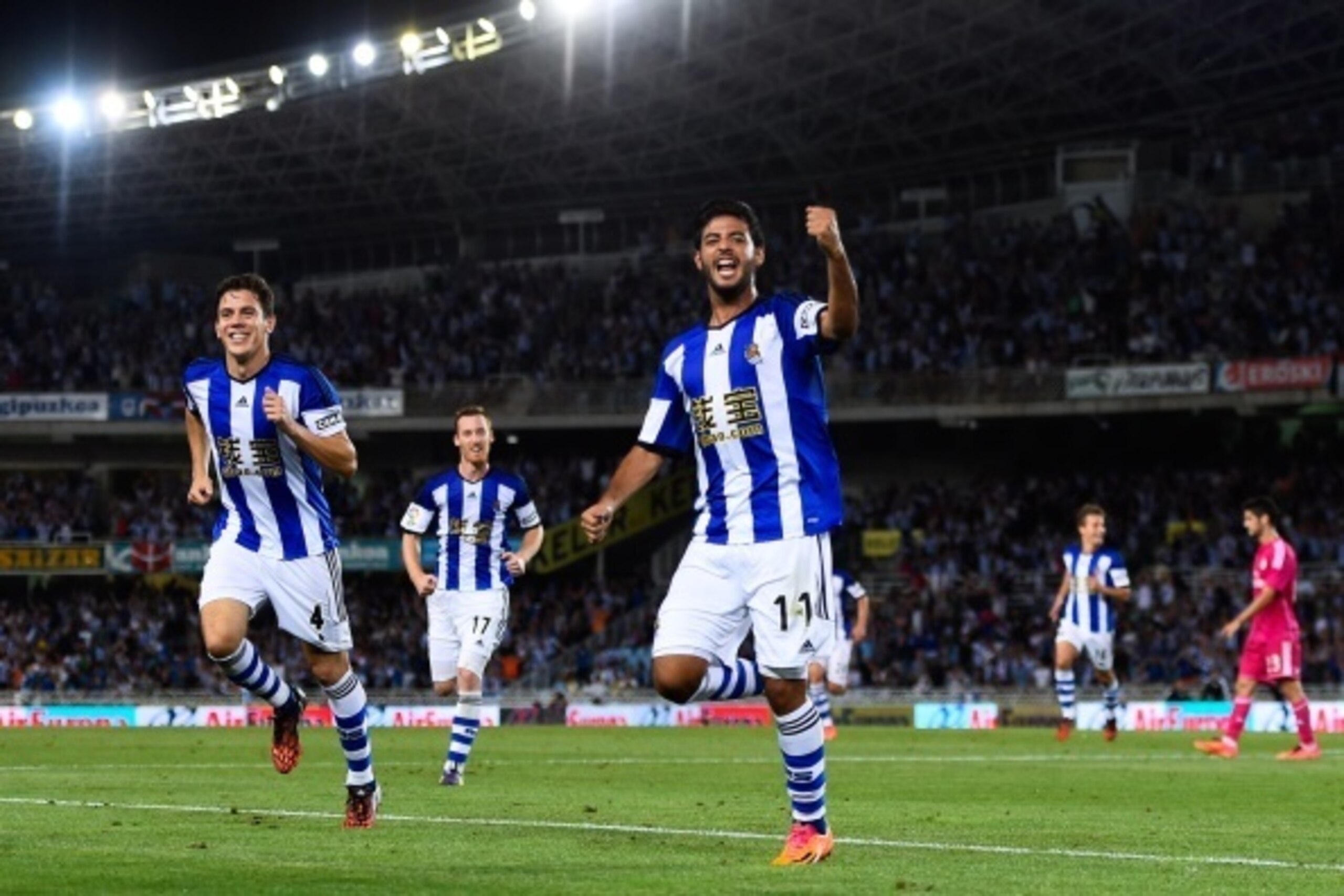SAN SEBASTIAN, SPAIN - AUGUST 31:  Carlos Vela Garrido of Real Sociedad celebrates after scoring his team's fourth goal during the La Liga match between Real Sociedad de Futbol and Real Madrid CF at Estadio Anoeta on August 31, 2014 in San Sebastian, Spai