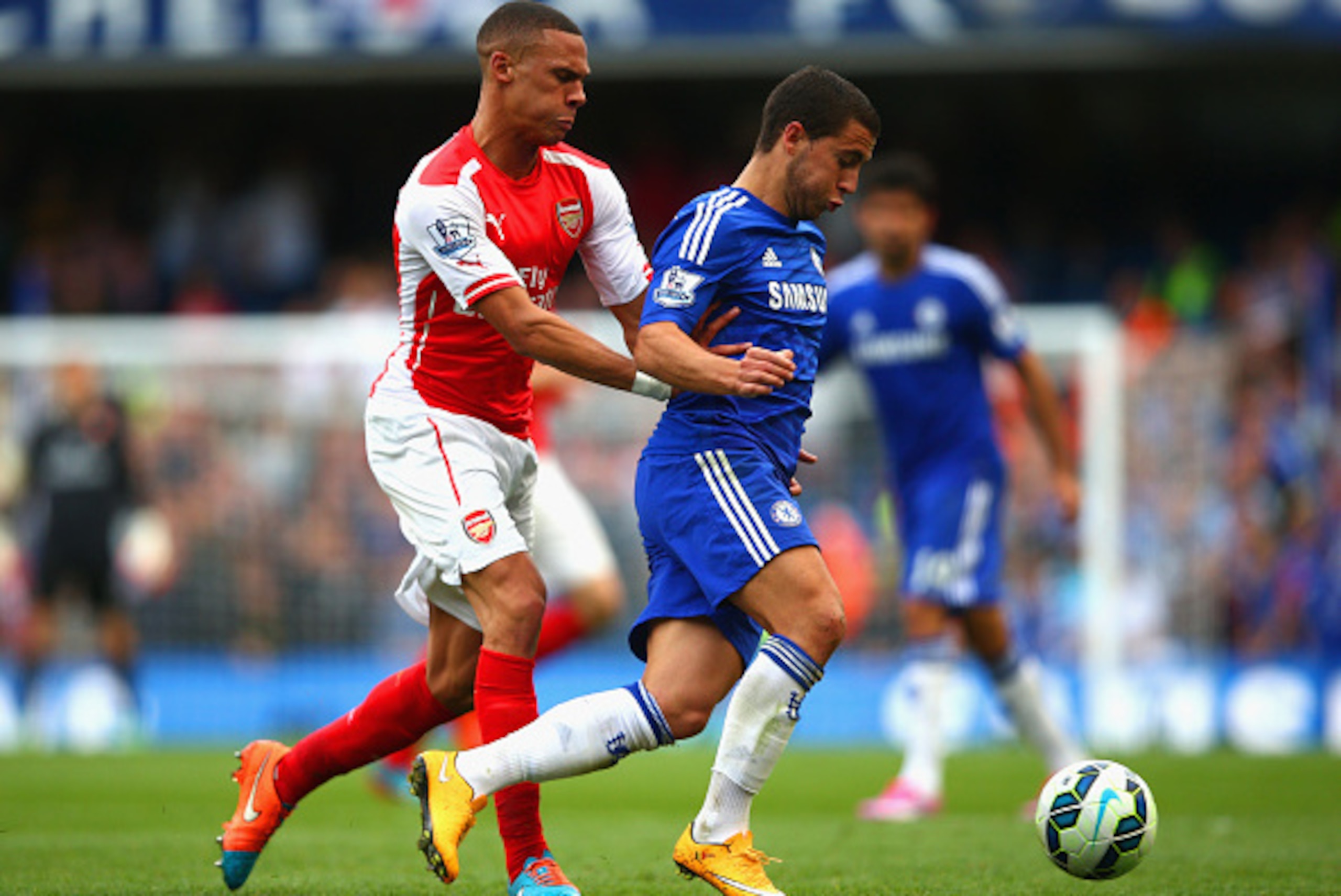 LONDON, ENGLAND - OCTOBER 05: Kieran Gibbs of Arsenal marshalls Eden Hazard of Chelsea during the Barclays Premier League match between Chelsea and Arsenal at Stamford Bridge on October 4, 2014 in London, England.  (Photo by Paul Gilham/Getty Images)