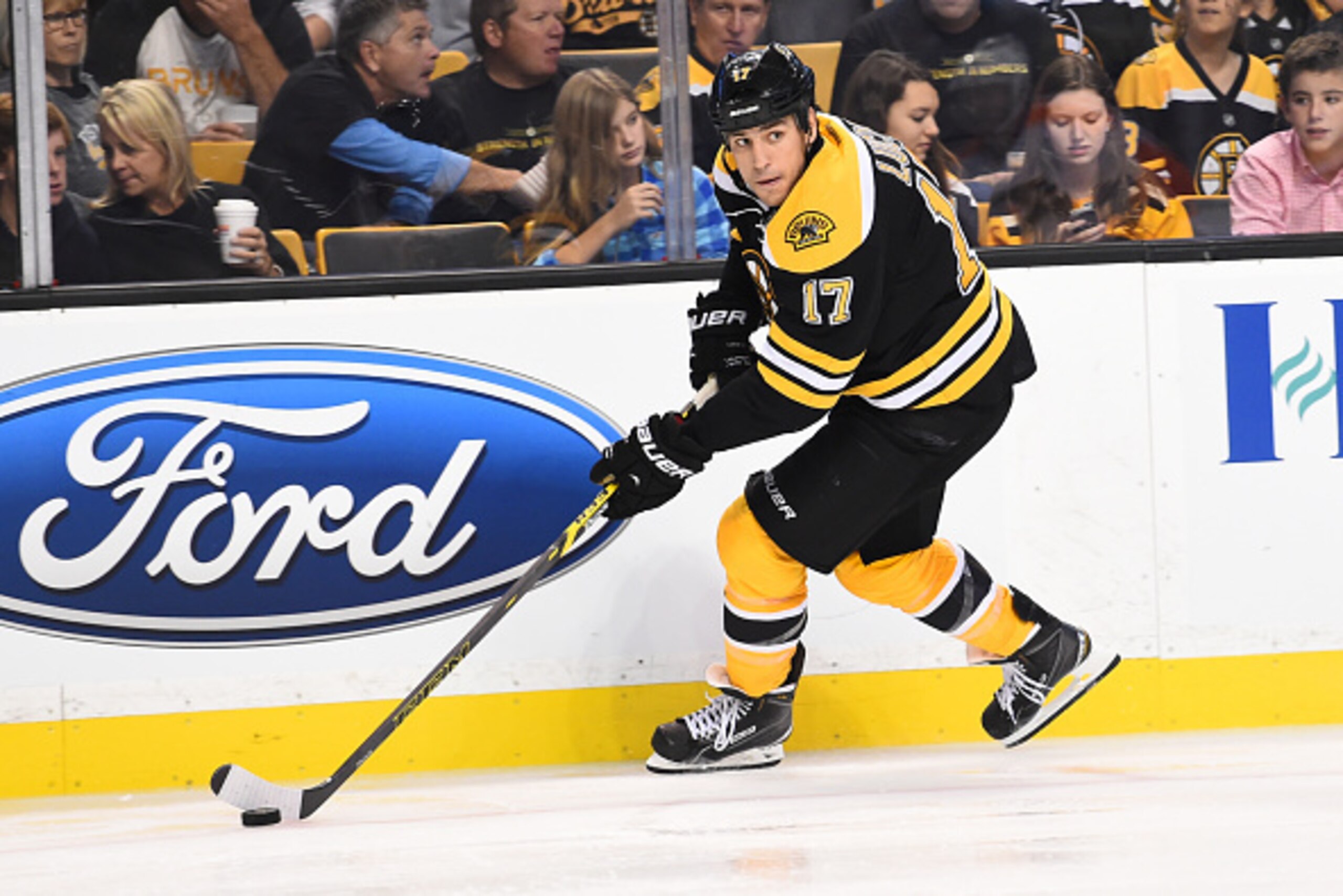 BOSTON, MA - OCTOBER 08: Milan Lucic #17 of the Boston Bruins skates with the puck against the Philadelphia Flyers during the season opener at the TD Garden on October 8, 2014 in Boston, Massachusetts.  (Photo by Brian Babineau/NHLI via Getty Images)