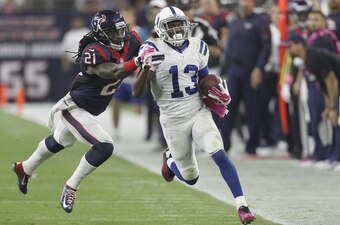 HOUSTON, TX- OCTOBER 09: T.Y. Hilton #13 of the Indianapolis Colts is pushed out of bounds by Kendrick Lewis #21 of the Houston Texans in the third quarter in a NFL game on October 9, 2014 at NRG Stadium in Houston, Texas. (Photo by Bob Levey/Getty Images