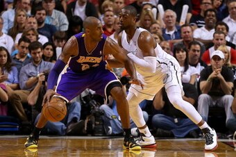 MIAMI, FL - FEBRUARY 10:  Kobe Bryant #24 of the Los Angeles Lakers drives around Dwyane Wade #3 of the Miami Heat during a game  at American Airlines Arena on February 10, 2013 in Miami, Florida.  (Photo by Mike Ehrmann/Getty Images)