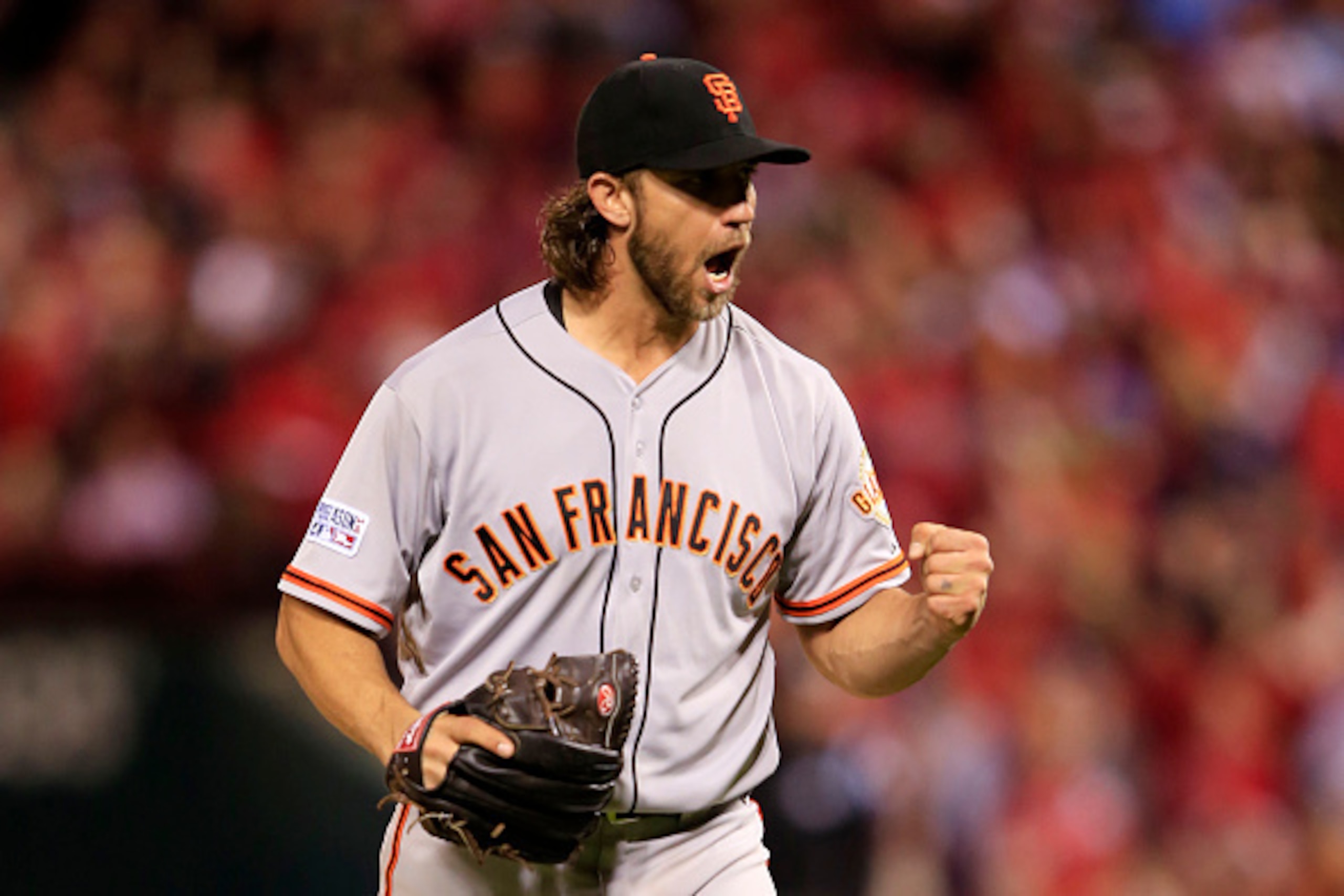 ST LOUIS, MO - OCTOBER 11:  Madison Bumgarner #40 of the San Francisco Giants celebrates the final out of the seventh inning against the St. Louis Cardinals during Game One of the National League Championship Series at Busch Stadium on October 11, 2014 in