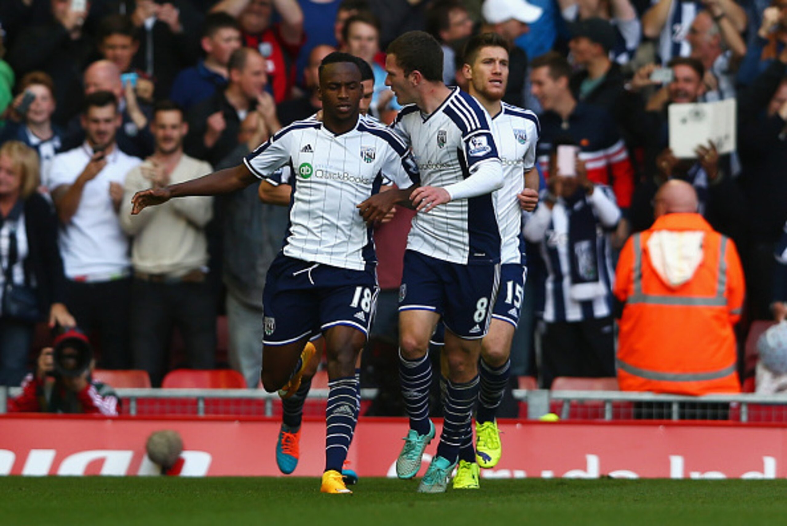 LIVERPOOL, ENGLAND - OCTOBER 04:  Saido Berahino of West Brom celebrates scoring their first goal with Craig Gardner of West Brom during the Barclays Premier League match between Liverpool and West Bromwich Albion at Anfield on October 4, 2014 in Liverpoo