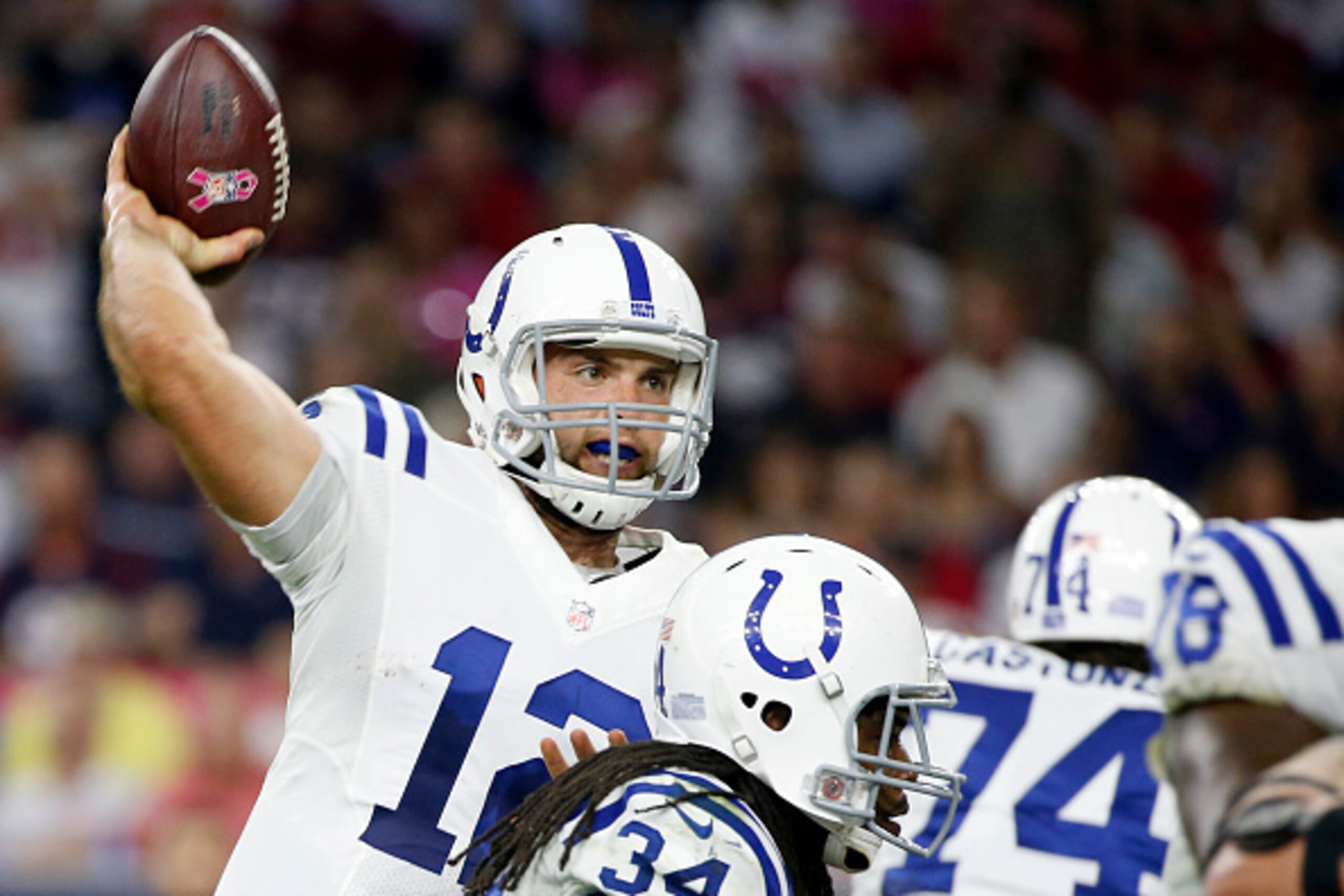 HOUSTON, TX- OCTOBER 09: Andrew Luck #12 of the Indianapolis Colts passes against the Houston Texans in the first quarter in a NFL game on October 9, 2014 at NRG Stadium in Houston, Texas. (Photo by Scott Halleran/Getty Images)