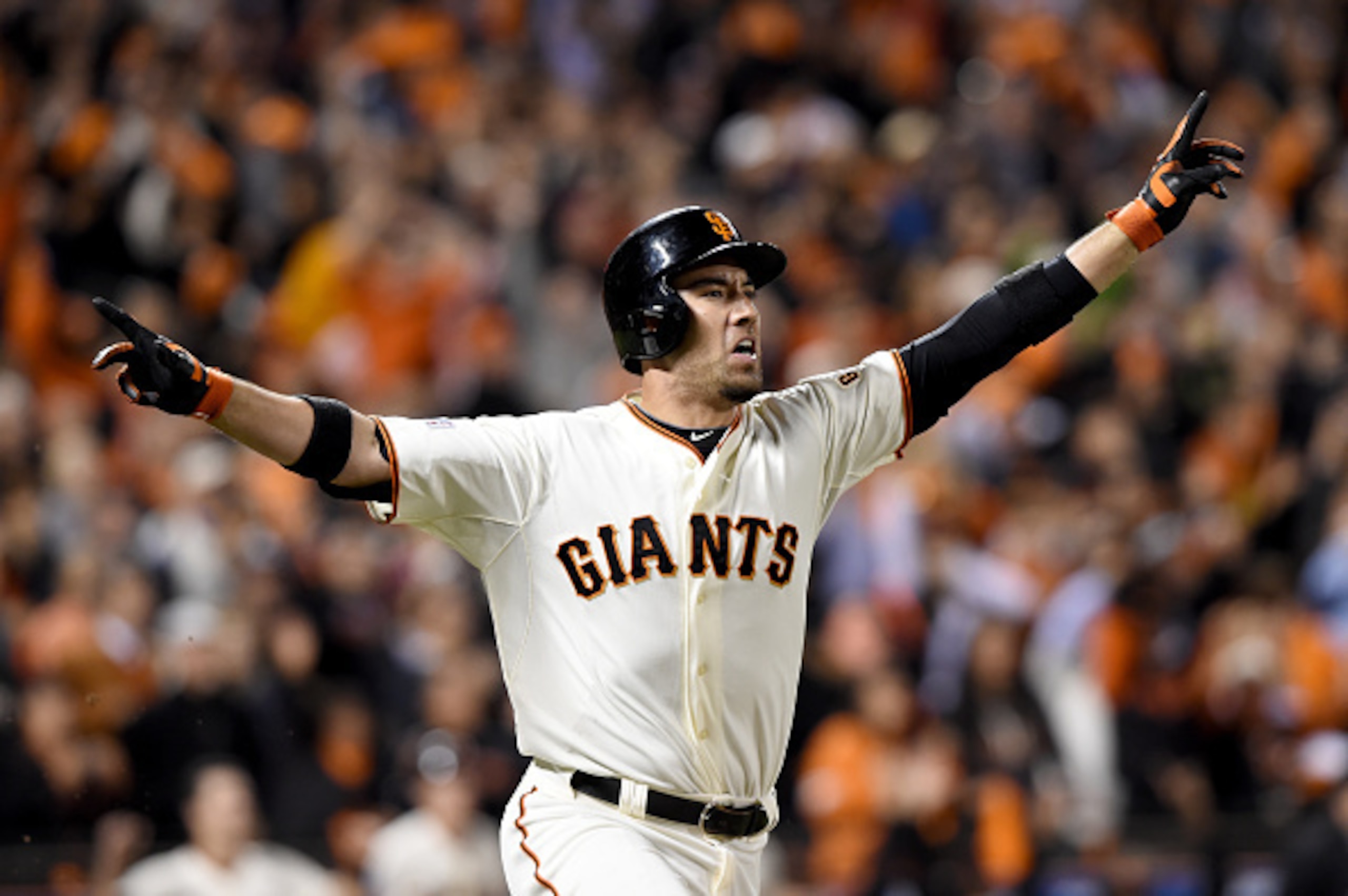 SAN FRANCISCO, CA - OCTOBER 16:  Travis Ishikawa #45 of the San Francisco Giants celebrates after he hits a three-run walk-off home run to defeat the St. Louis Cardinals 6-3 during Game Five of the National League Championship Series at AT&T Park on Octob