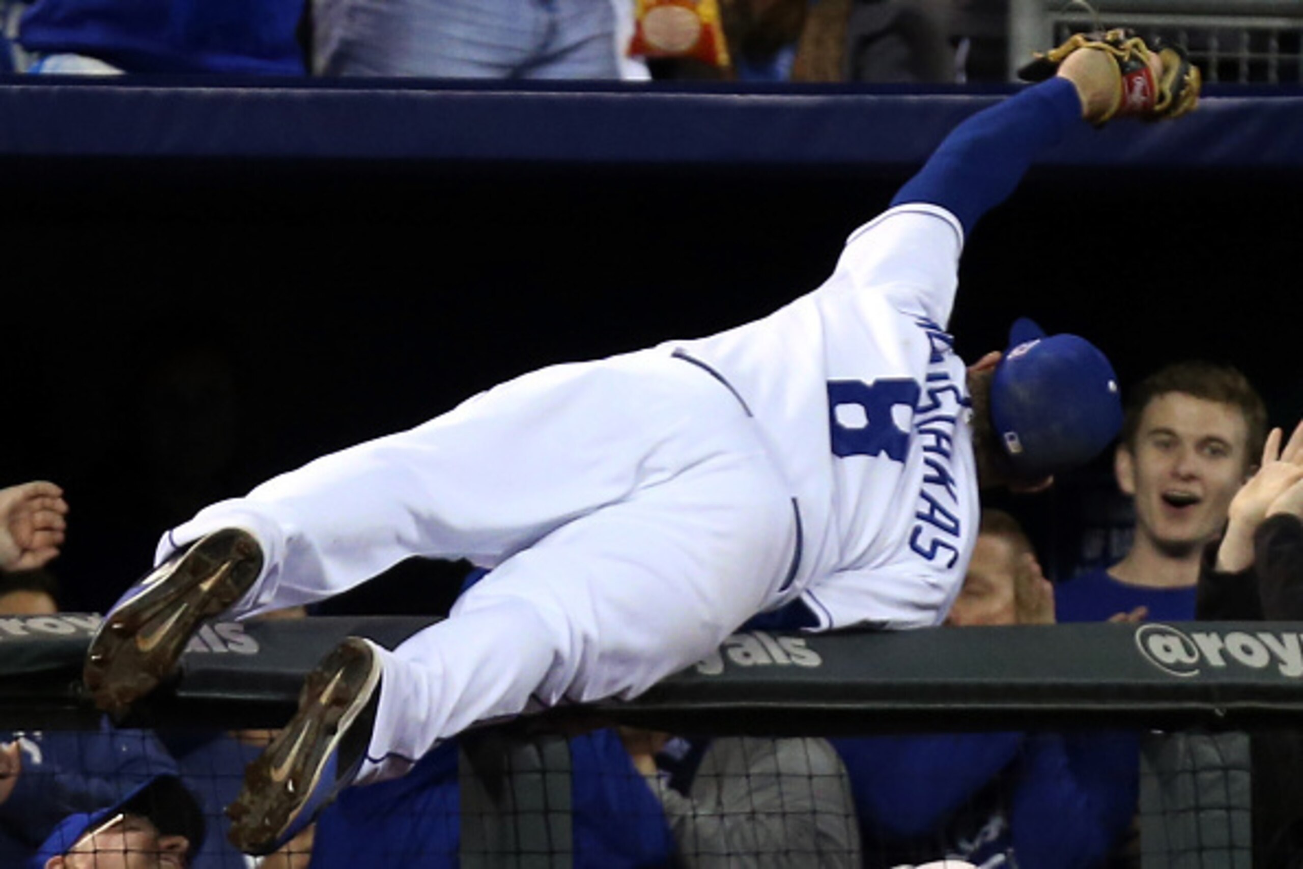 KANSAS CITY, MO - OCTOBER 14:  Mike Moustakas #8 of the Kansas City Royals catches a foul ball hit by Adam Jones #10 of the Baltimore Orioles in the sixth inning during Game Three of the American League Championship Series at Kauffman Stadium on October 1