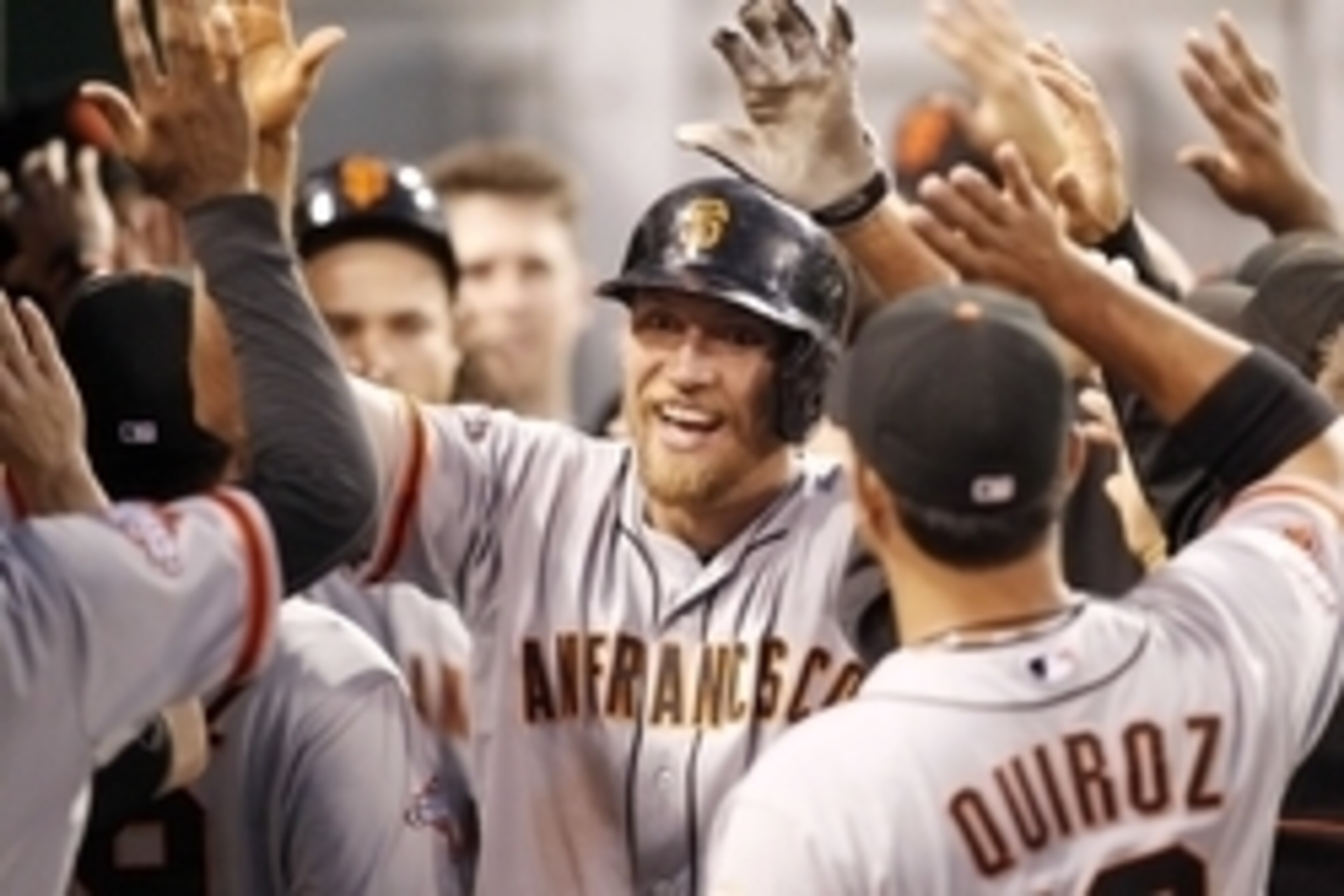 Jun 13, 2013; Pittsburgh, PA, USA; San Francisco Giants right fielder Hunter Pence (center) is congratulated by teammates in the dugout after hitting a three run home run against the Pittsburgh Pirates during the sixth inning at PNC Park. Mandatory Credit