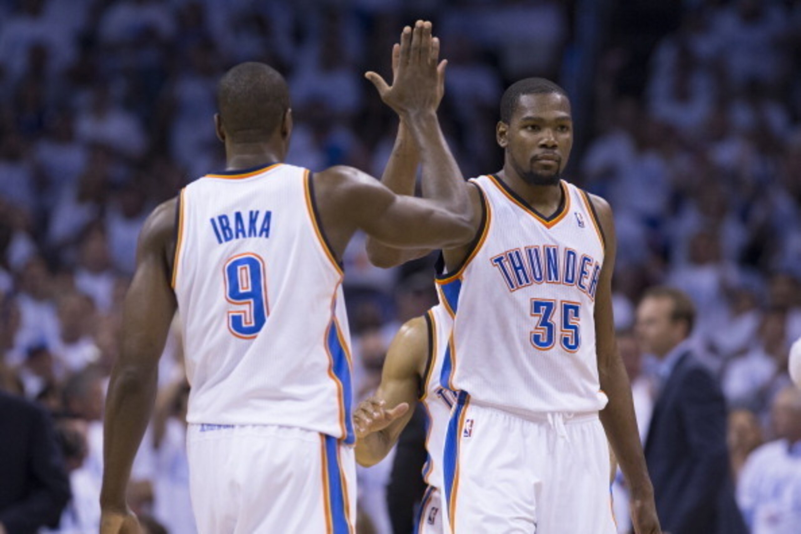 OKLAHOMA CITY, OK - May 31: Kevin Durant #35 and Serge Ibaka #9 of the Oklahoma City Thunder high five in Game 6 of the Western Conference Finals against the San Antonio Spurs during the 2014 NBA Playoffs at the Chesapeake Energy Arena on May 31, 2014 in 