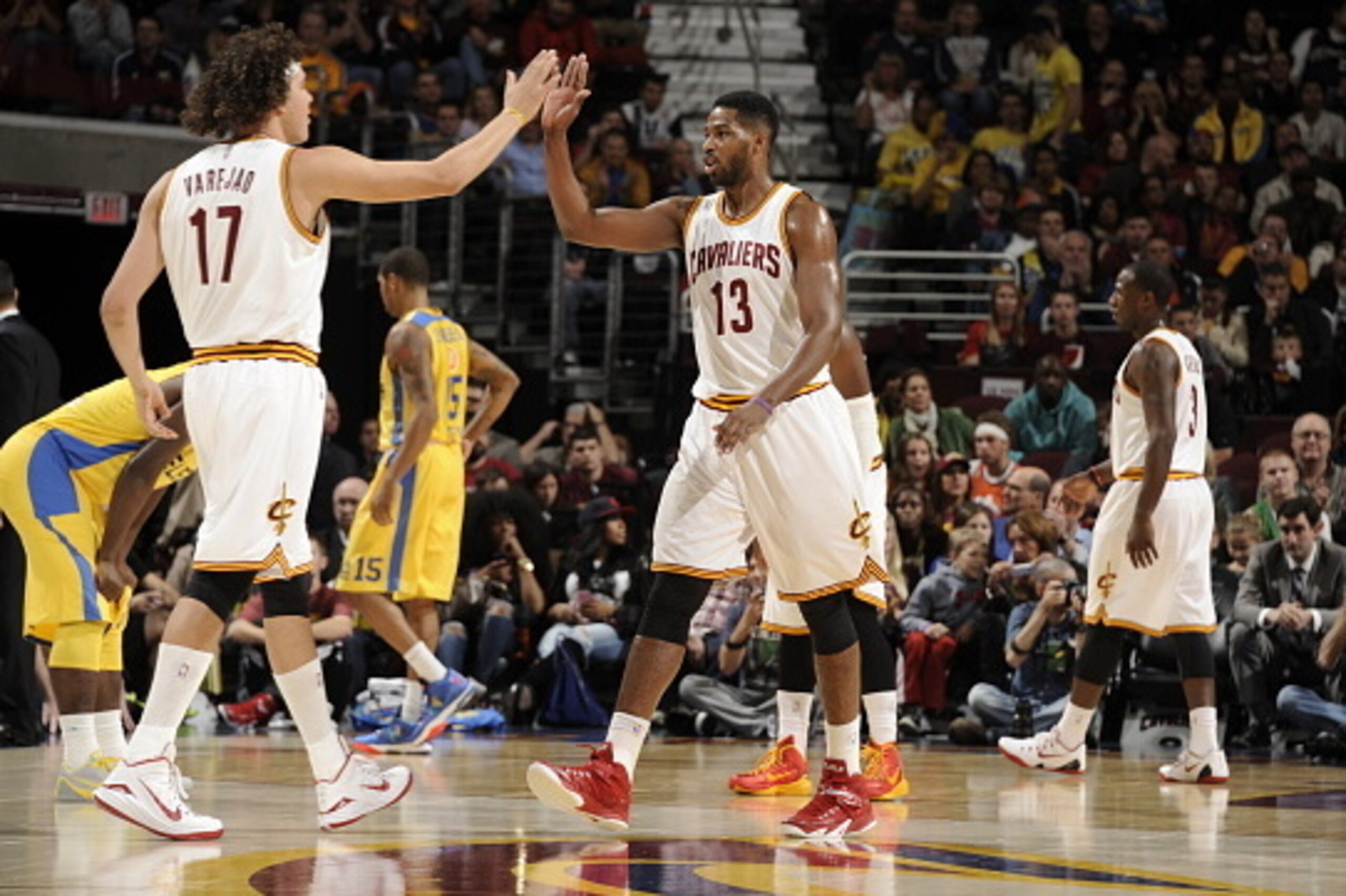 CLEVELAND, OH - OCTOBER 5:  Anderson Varejao #17 of the Cleveland Cavaliers high fives teammate Tristan Thompson #13 of the Cleveland Cavaliers during the game against Maccabi Tel Aviv at The Quicken Loans Arena on October 16, 2014 in Cleveland, Ohio. NOT