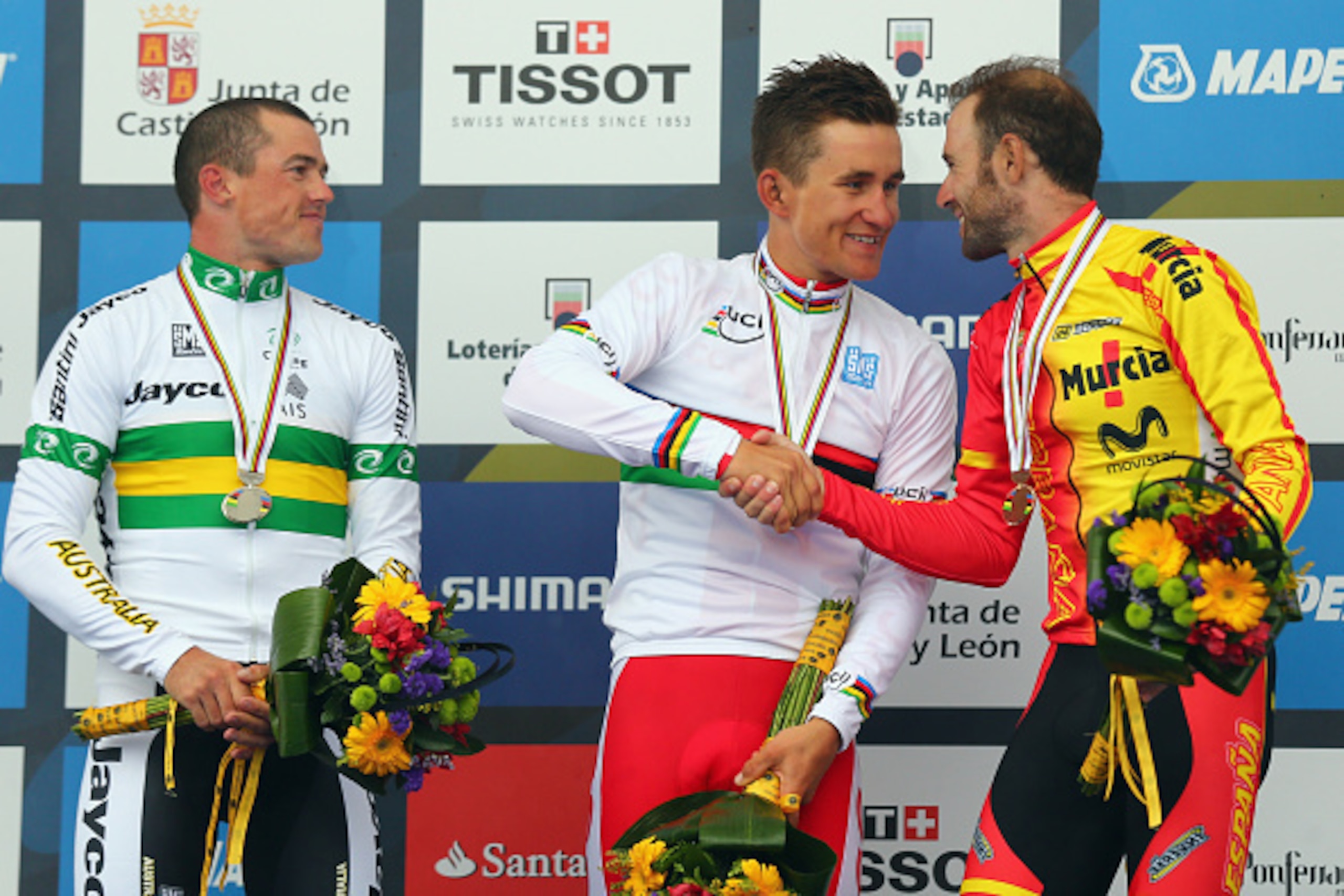 PONFERRADA, SPAIN - SEPTEMBER 28:  (l to r) Simon Gerrans (2nd) of Australia, Michal Kwiatkowski (1st) of Poland and Alejandro Valverde (3rd) of Spain stand on the podium after the Elite Men's Road Race on day seven of the UCI Road World Championships on 