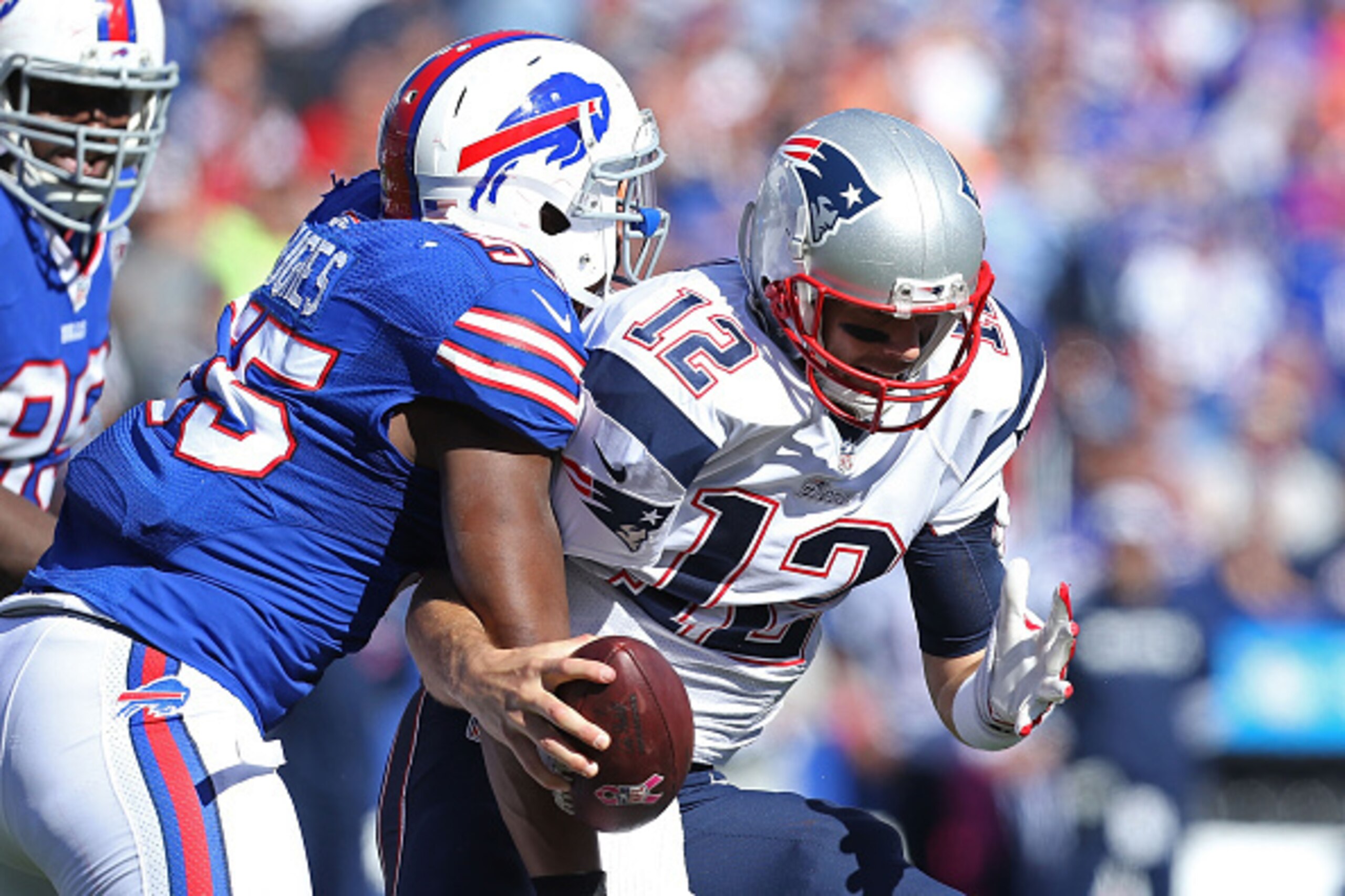 ORCHARD PARK, NY - OCTOBER 12: Tom Brady #12 of the New England Patriots is sacked by Jerry Hughes #55 of the Buffalo Bills during the first half at Ralph Wilson Stadium on October 12, 2014 in Orchard Park, New York. (Photo by Brett Carlsen/Getty Image ORCHARD PARK, NY - OCTOBER 12: Tom Brady #12 of the New England Patriots is sacked by Jerry Hughes #55 of the Buffalo Bills during the first half at Ralph Wilson Stadium on October 12, 2014 in Orchard Park, New York. (Photo by Brett Carlsen/Getty Image