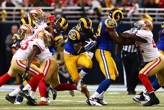ST LOUIS, MO - OCTOBER 13:   Zac Stacy #30 of the St. Louis Rams runs the ball against the San Francisco 49ers in the first quarter at Edward Jones Dome on October 13, 2014 in St Louis, Missouri.  (Photo by Dilip Vishwanat/Getty Images)