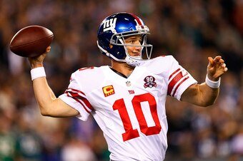 PHILADELPHIA, PA - OCTOBER 12: Eli Manning #10 of the New York Giants looks to pass against the Philadelphia Eagles during the first quarter in a football game at Lincoln Financial Field on October 12, 2014 in Philadelphia, Pennsylvania. The Eagles defeat