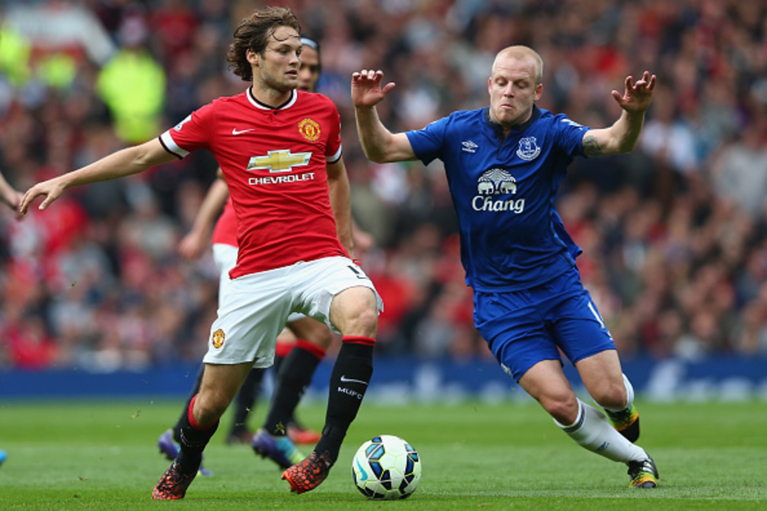 MANCHESTER, ENGLAND - OCTOBER 05:  Steven Naismith of Everton competes with Daley Blind of Manchester United during the Barclays Premier League match between Manchester United and Everton at Old Trafford on October 5, 2014 in Manchester, England.  (Photo 