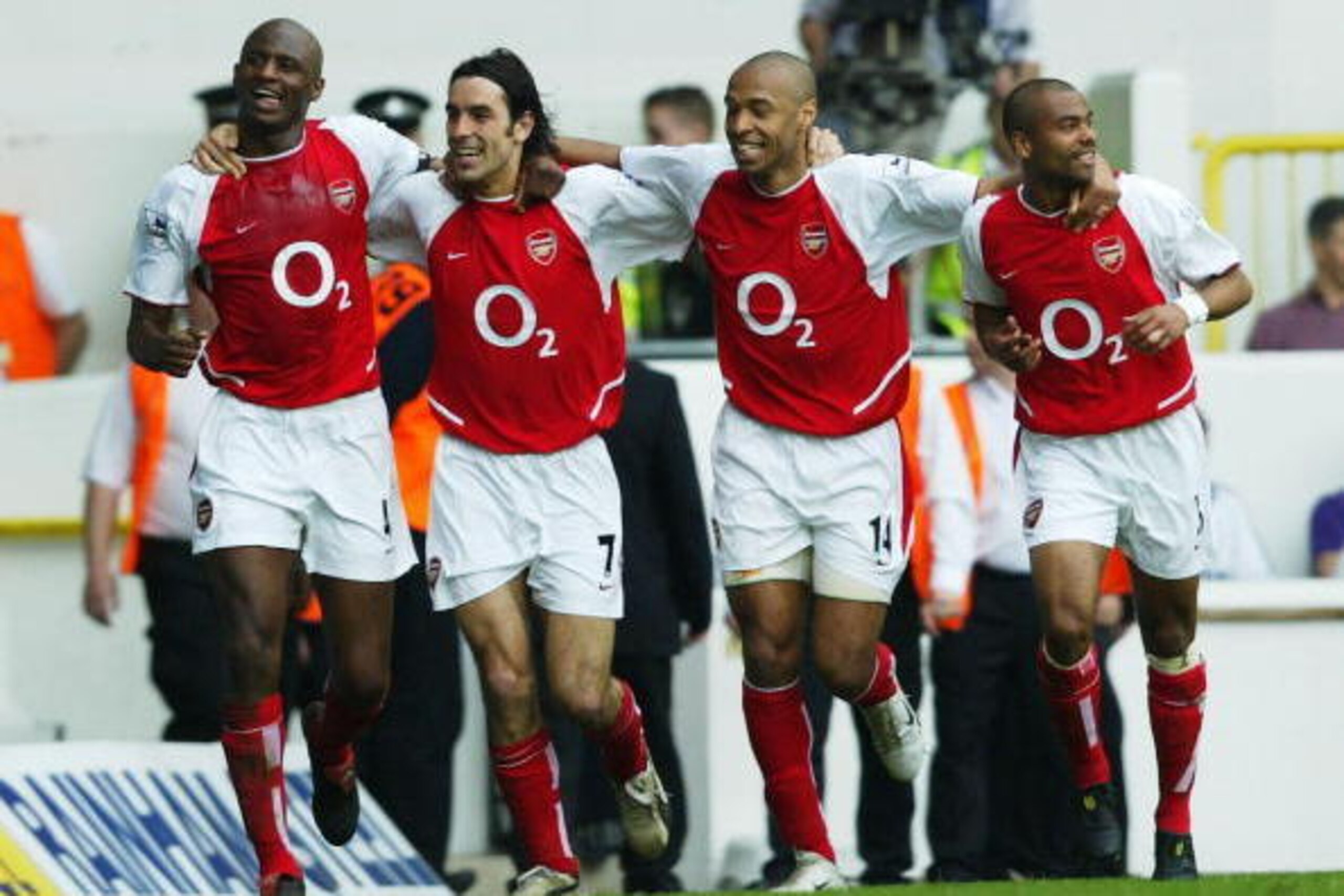 LONDON - APRIL 25: Patrick Vieira, Robert Pires, Thierry Henry and Ashley Cole of Arsenal celebrate after the second goal during the FA Barclaycard Premiership match between Tottenham Hotspur and Arsenal at White Hart Lane on April 25, 2004 in London.  (P