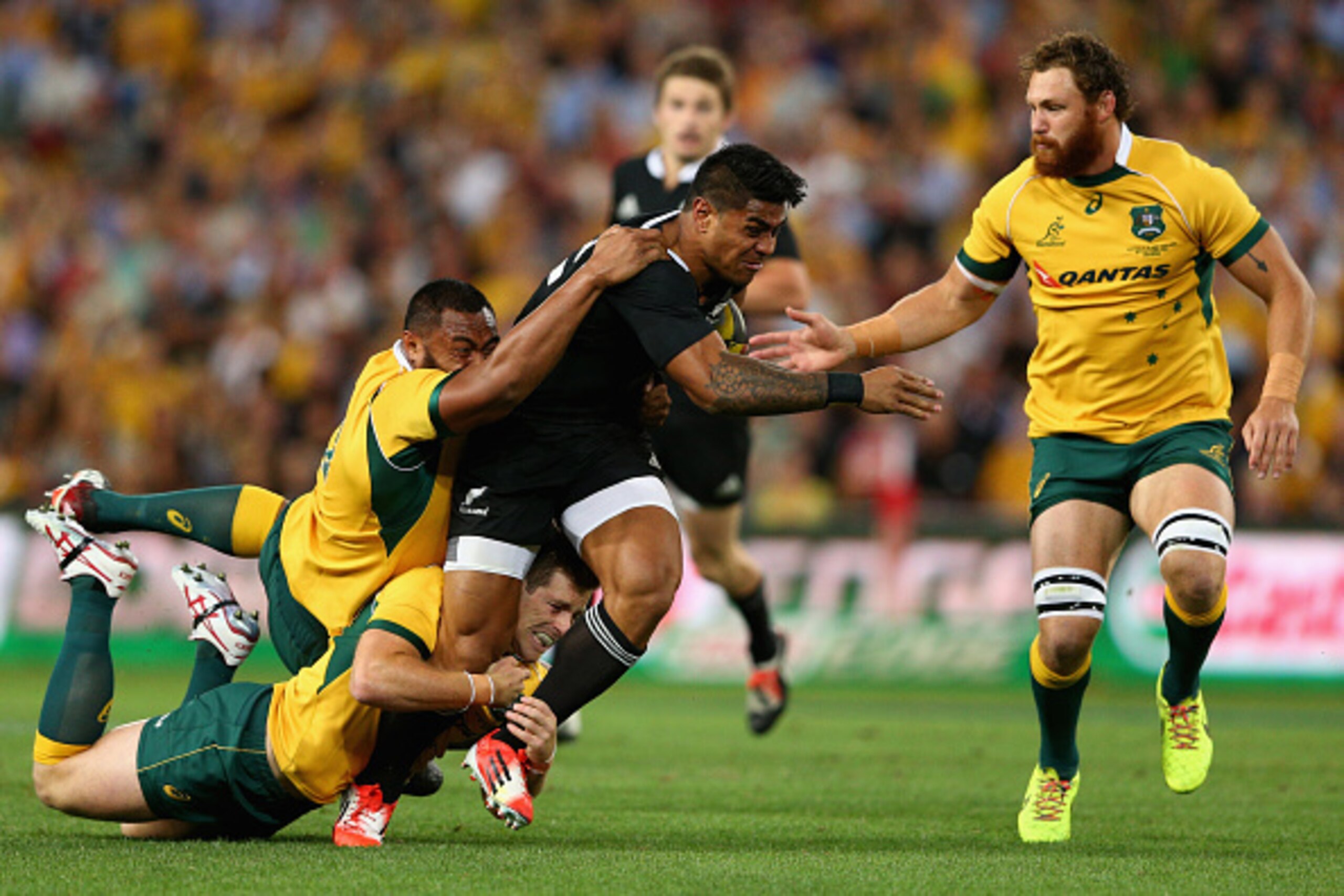 BRISBANE, AUSTRALIA - OCTOBER 18: Malakai Fekitoa of the All Blacks is tackled during The Rugby Championship match between the Australian Wallabies and the New Zealand All Blacks at Suncorp Stadium on October 18, 2014 in Brisbane, Australia.  (Photo by Ca