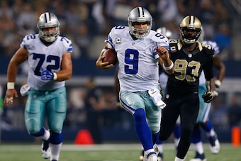 ARLINGTON, TX - SEPTEMBER 28:  Tony Romo #9 of the Dallas Cowboys scrambles against the New Orleans Saints in the second half at AT&T Stadium on September 28, 2014 in Arlington, Texas.  (Photo by Tom Pennington/Getty Images)
