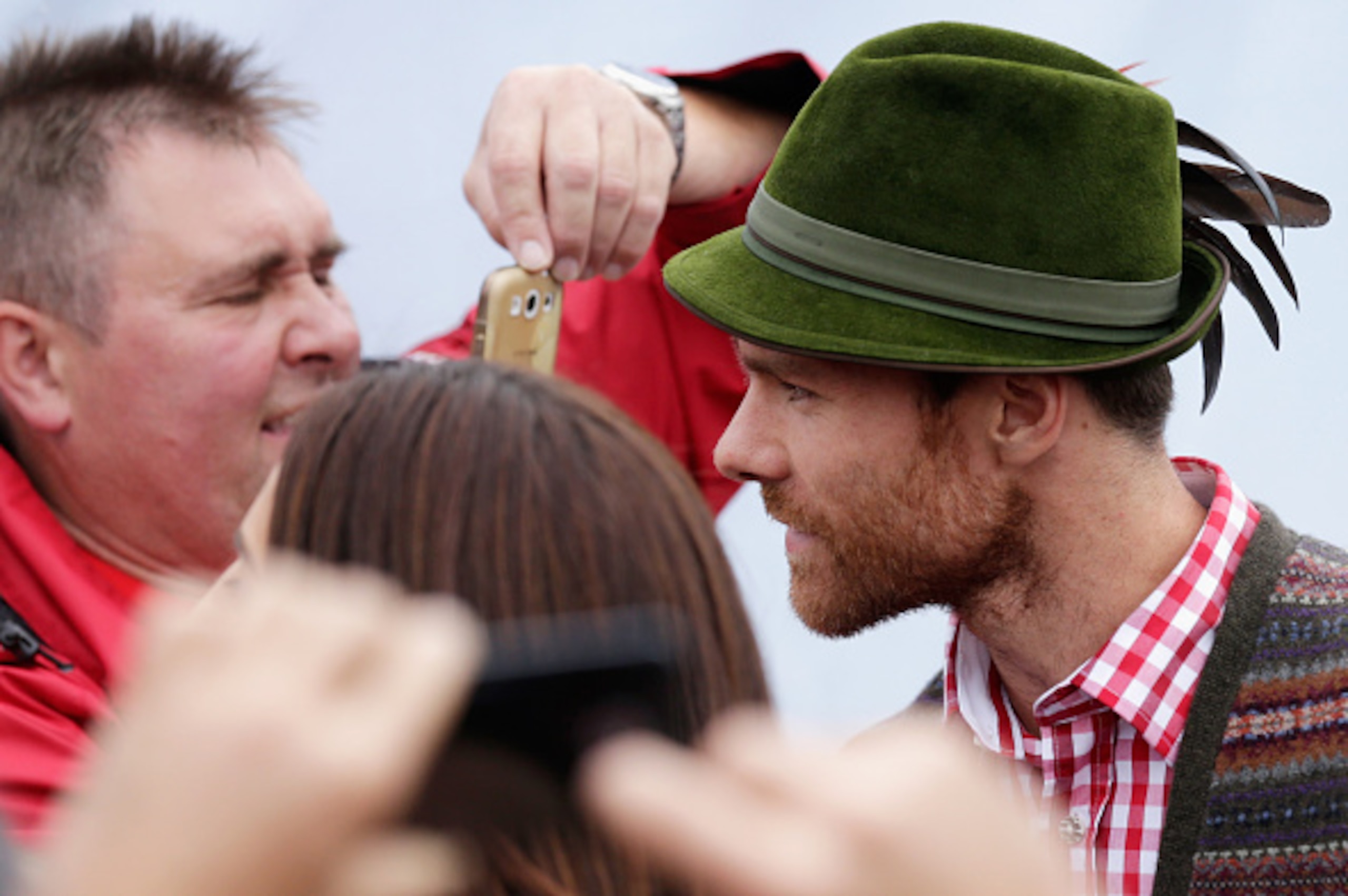 MUNICH, GERMANY - OCTOBER 05:  Xabi Alonso (R), football player of Bayern Muenchen arrives for the Oktoberfest beer festival at Kaefer Wiesnschaenke tent at Theresienwiese on October 5, 2014 in Munich, Germany  (Photo by Johannes Simon/Getty Images)