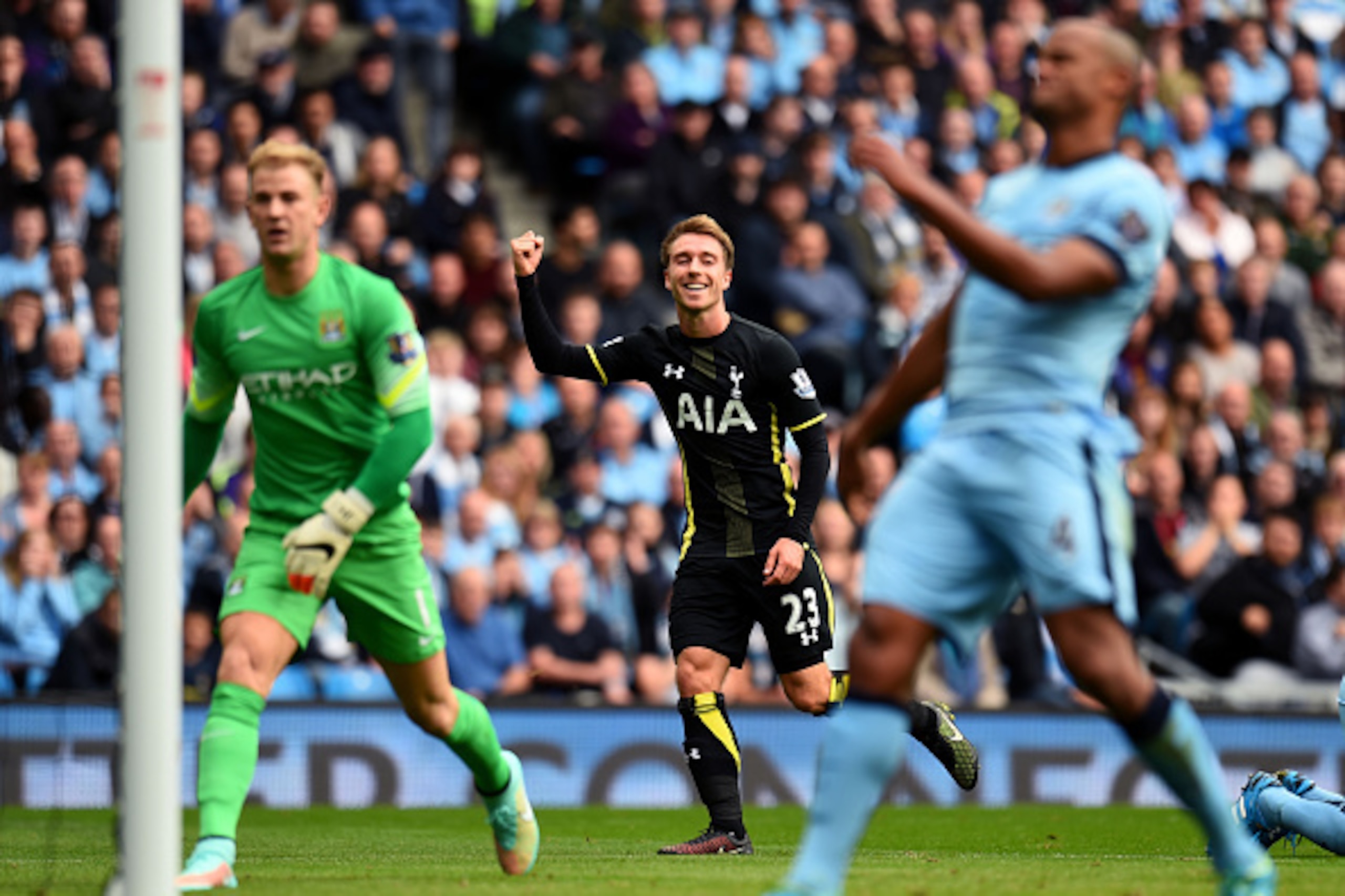 MANCHESTER, ENGLAND - OCTOBER 18:  Christian Eriksen of Spurs celebrates after scoring a goal to level the scores at 1-1 during the Barclays Premier League match between Manchester City and Tottenham Hotspur at Etihad Stadium on October 18, 2014 in Manche