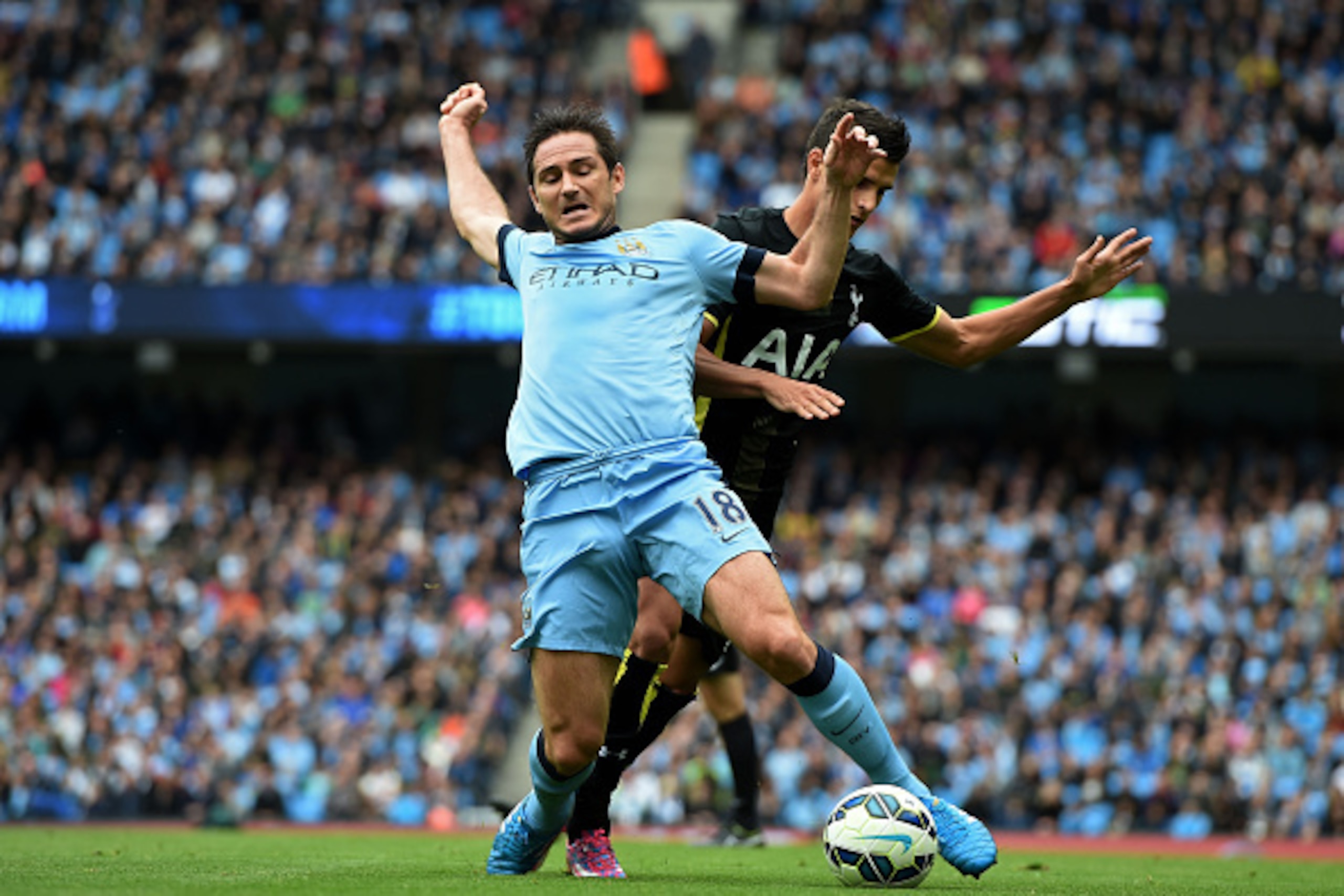 MANCHESTER, ENGLAND - OCTOBER 18:  Frank Lampard of Manchester City wins his team's first peanlty as he is brought down by Erik Lamela of Spurs during the Barclays Premier League match between Manchester City and Tottenham Hotspur at Etihad Stadium on Oct