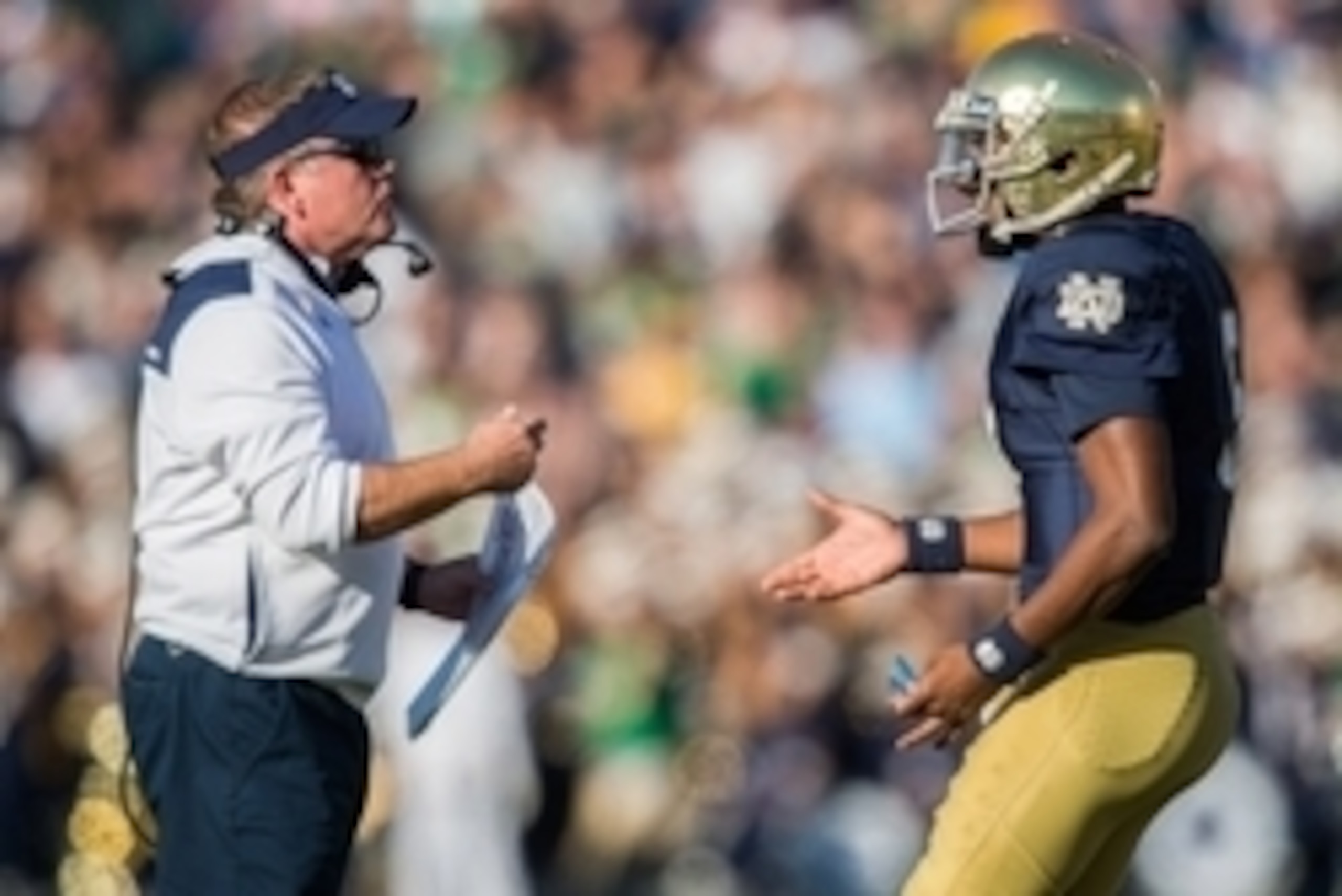 Oct 11, 2014; South Bend, IN, USA; Notre Dame Fighting Irish head coach Brian Kelly talks with quarterback Everett Golson (5) in the second quarter against the North Carolina Tar Heels at Notre Dame Stadium. Mandatory Credit: Matt Cashore-USA TODAY Sports