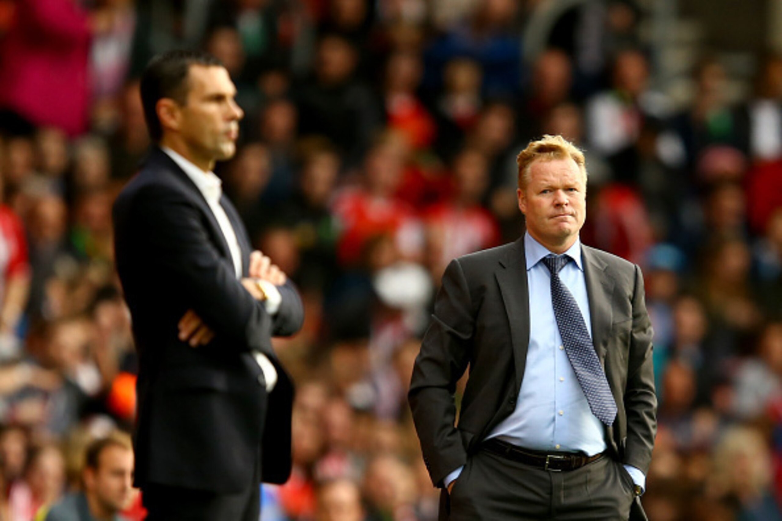 SOUTHAMPTON, ENGLAND - OCTOBER 18:  Southampton manager Ronald Koeman looks over towards Sunderland manager Gus Poyet during the Barclays Premier League match between Southampton and Sunderland at St Mary's Stadium on October 18, 2014 in Southampton, Engl