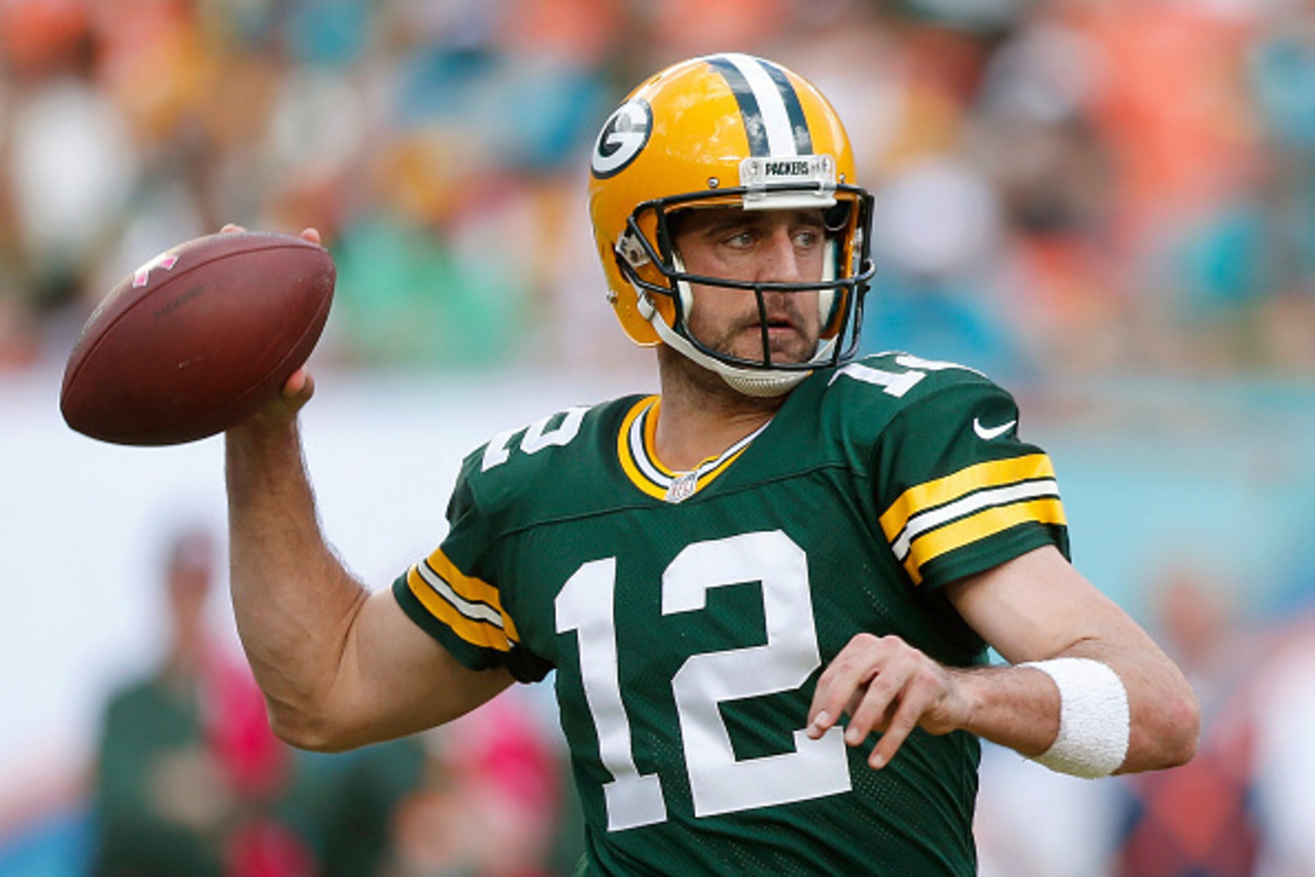 MIAMI GARDENS, FL - OCTOBER 12: Quarterback Aaron Rodgers #12 of the Green Bay Packers throws in the second quarter during a game against the Miami Dolphins at Sun Life Stadium on October 12, 2014 in Miami Gardens, Florida. (Photo by Joel Auerbach/Getty MIAMI GARDENS, FL - OCTOBER 12: Quarterback Aaron Rodgers #12 of the Green Bay Packers throws in the second quarter during a game against the Miami Dolphins at Sun Life Stadium on October 12, 2014 in Miami Gardens, Florida. (Photo by Joel Auerbach/Getty