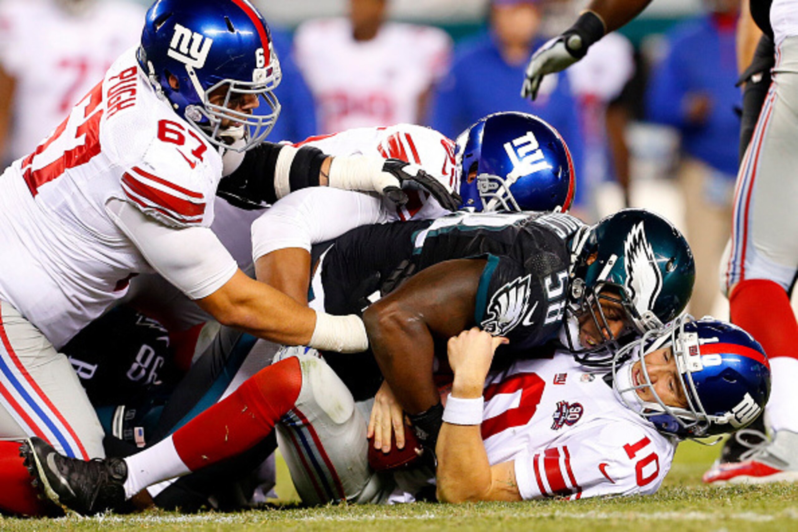 PHILADELPHIA, PA - OCTOBER 12: Trent Cole #58 and Connor Barwin #98 of the Philadelphia Eagles sacks Eli Manning #10 of the New York Giants during the fourth quarter of a football game at Lincoln Financial Field on October 12, 2014 in Philadelphia, Pennsy PHILADELPHIA, PA - OCTOBER 12: Trent Cole #58 and Connor Barwin #98 of the Philadelphia Eagles sacks Eli Manning #10 of the New York Giants during the fourth quarter of a football game at Lincoln Financial Field on October 12, 2014 in Philadelphia, Pennsy