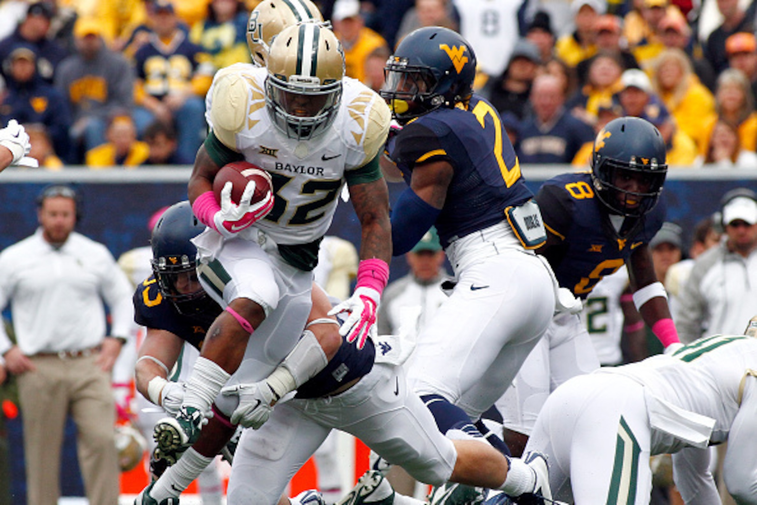 MORGANTOWN, WV - OCTOBER 18:  Shock Linwood #32 of the Baylor Bears rushes in the first half against the West Virginia Mountaineers during the game on October 18, 2014 at Mountaineer Field in Morgantown, West Virginia.  (Photo by Justin K. Aller/Getty Ima