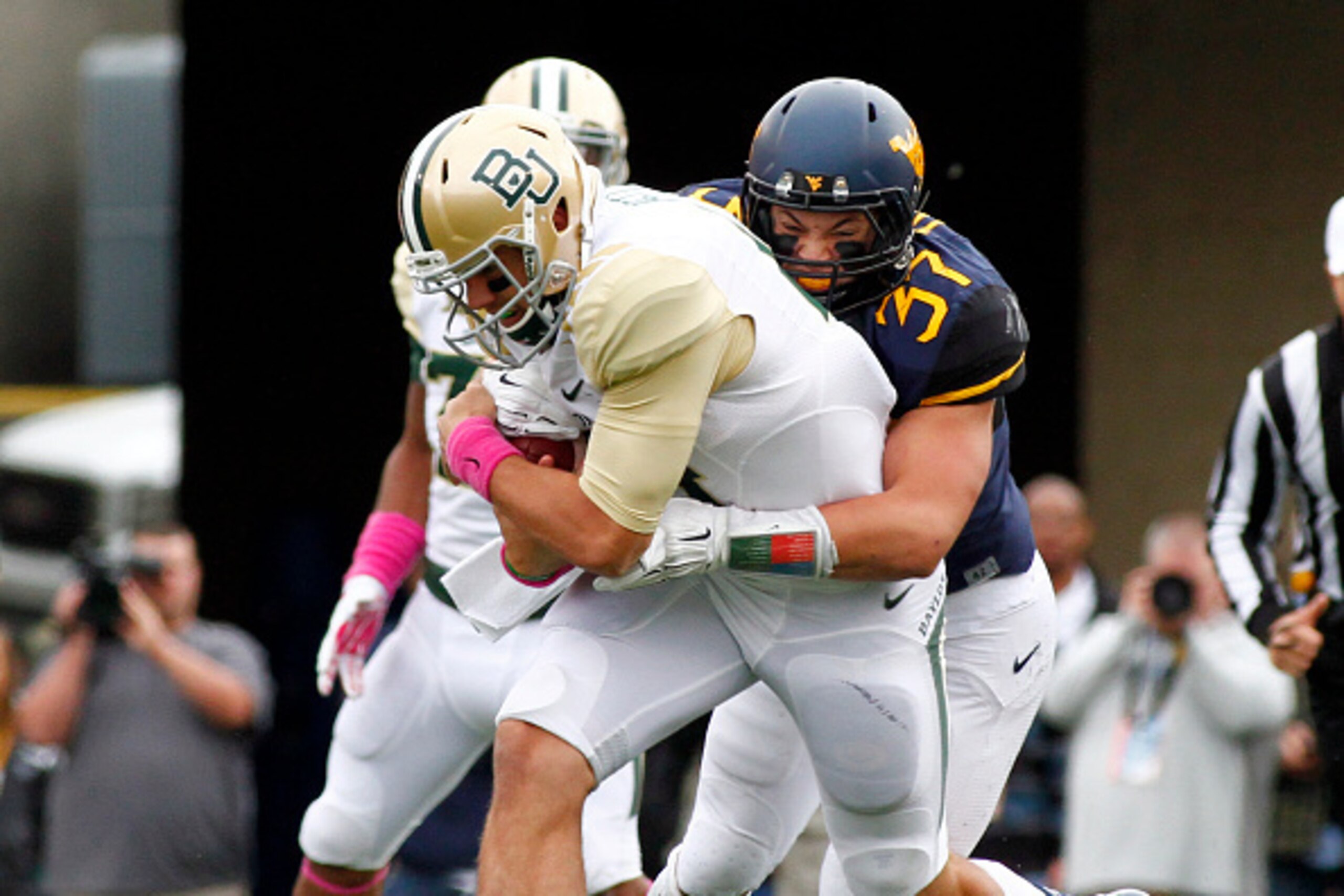 MORGANTOWN, WV - OCTOBER 18:  Wes Tonkery #37 of the West Virginia Mountaineers tackles Bryce Petty #14 of the Baylor Bears in the first half during the game on October 18, 2014 at Mountaineer Field in Morgantown, West Virginia.  (Photo by Justin K. Aller