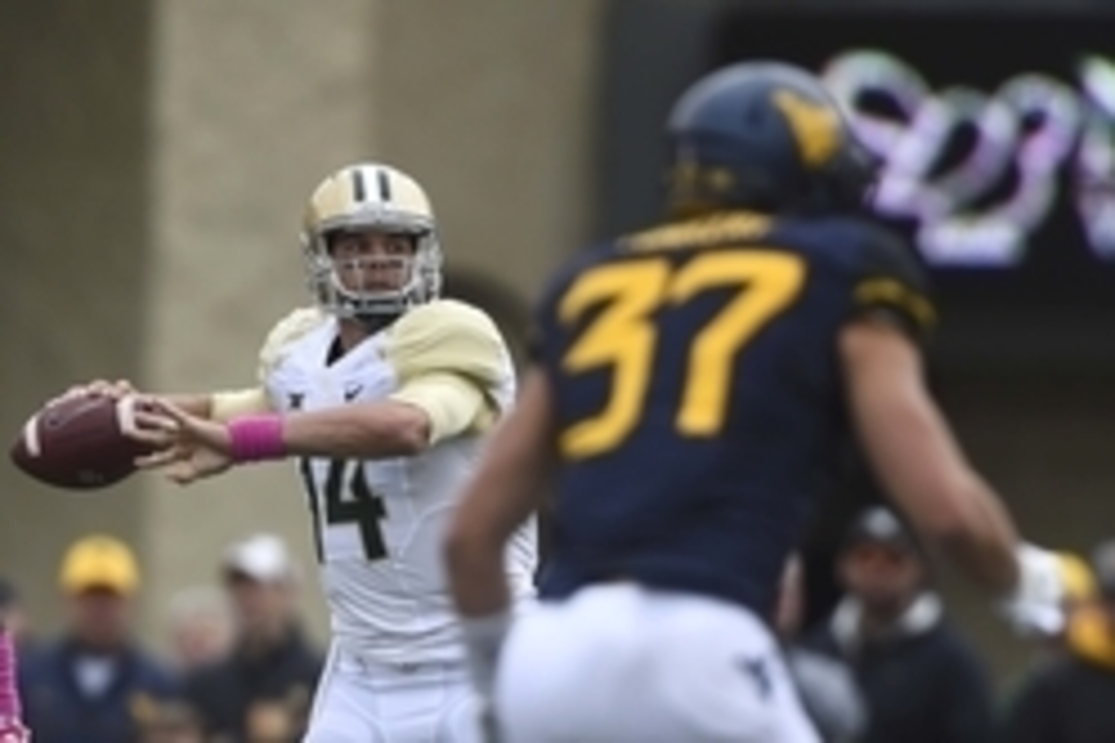 Oct 18, 2014; Morgantown, WV, USA;  Baylor Bears quarterback Bryce Petty (14) looks to throw during the second quarter against the West Virginia Mountaineers at Milan Puskar Stadium. Mandatory Credit: Tommy Gilligan-USA TODAY Sports