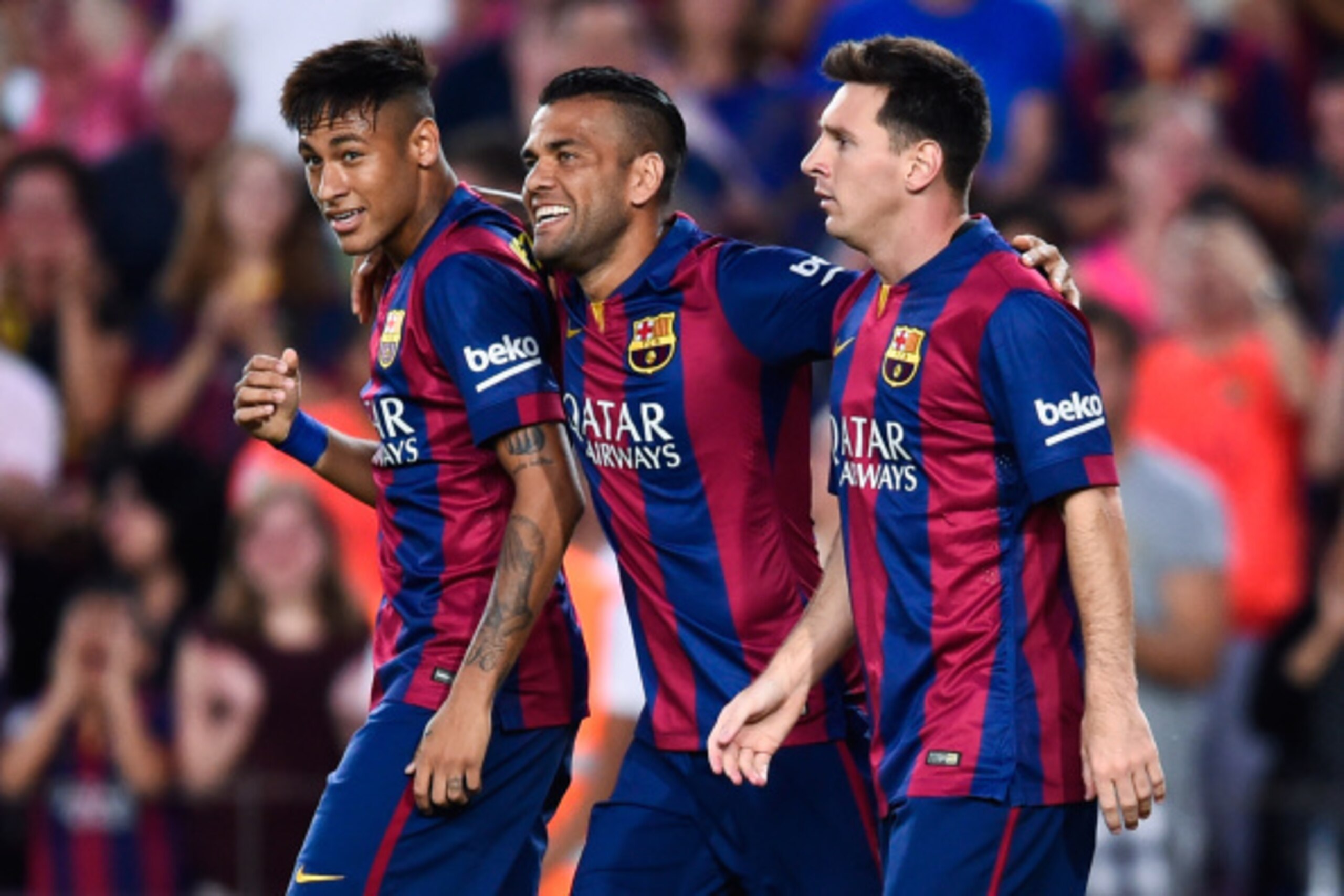 BARCELONA, SPAIN - AUGUST 18:  Lionel Messi of FC Barcelona celebrates with his teammates Neymar (L) and Dani Alves after scoring the opening goalduring the Joan Gamper Trophy match between FC Barcelona and Club Leon at Camp Nou on August 18, 2014 in Barc