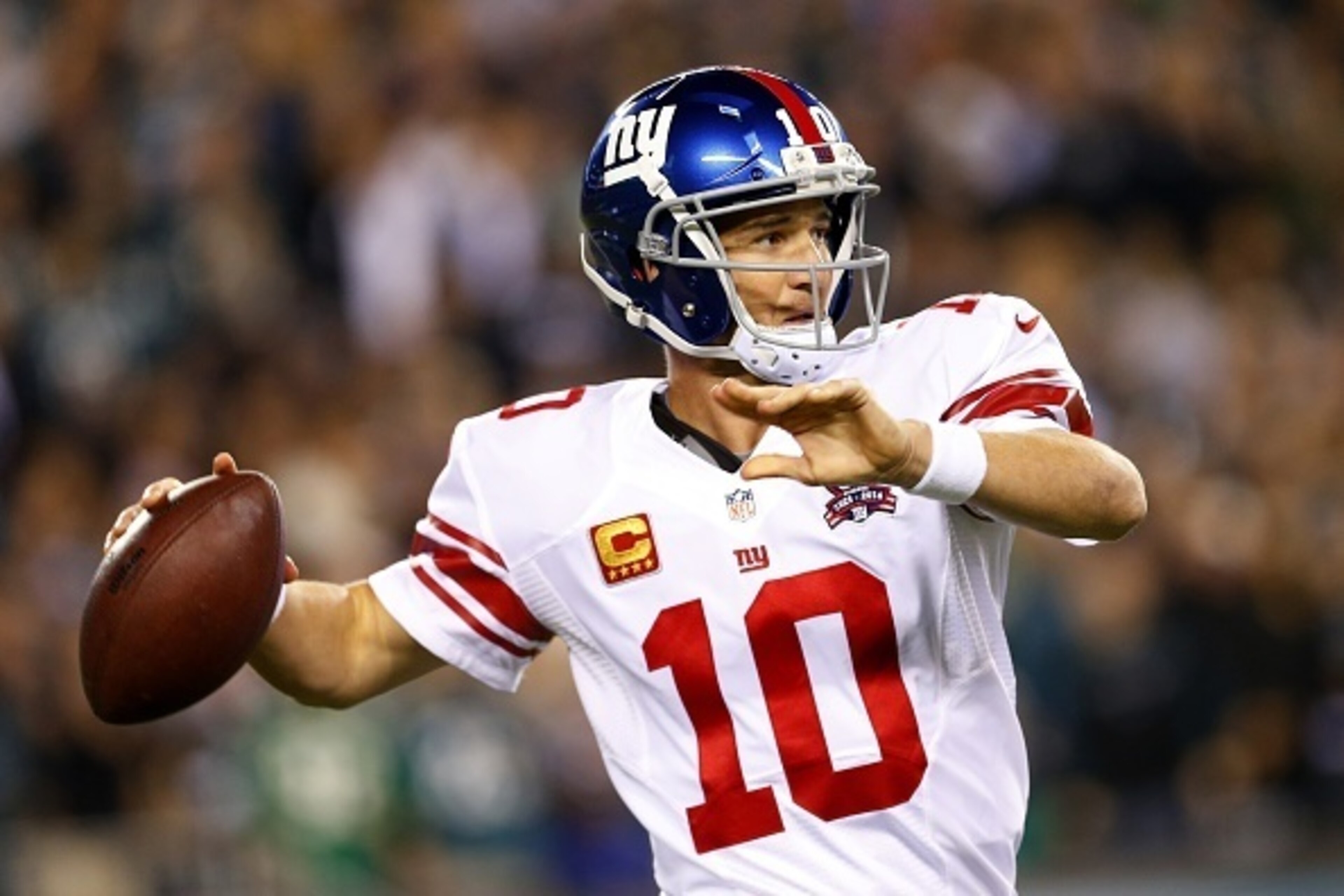 PHILADELPHIA, PA - OCTOBER 12: Eli Manning #10 of the New York Giants looks to pass against the Philadelphia Eagles during the first quarter in a football game at Lincoln Financial Field on October 12, 2014 in Philadelphia, Pennsylvania. (Photo by Rich Sc