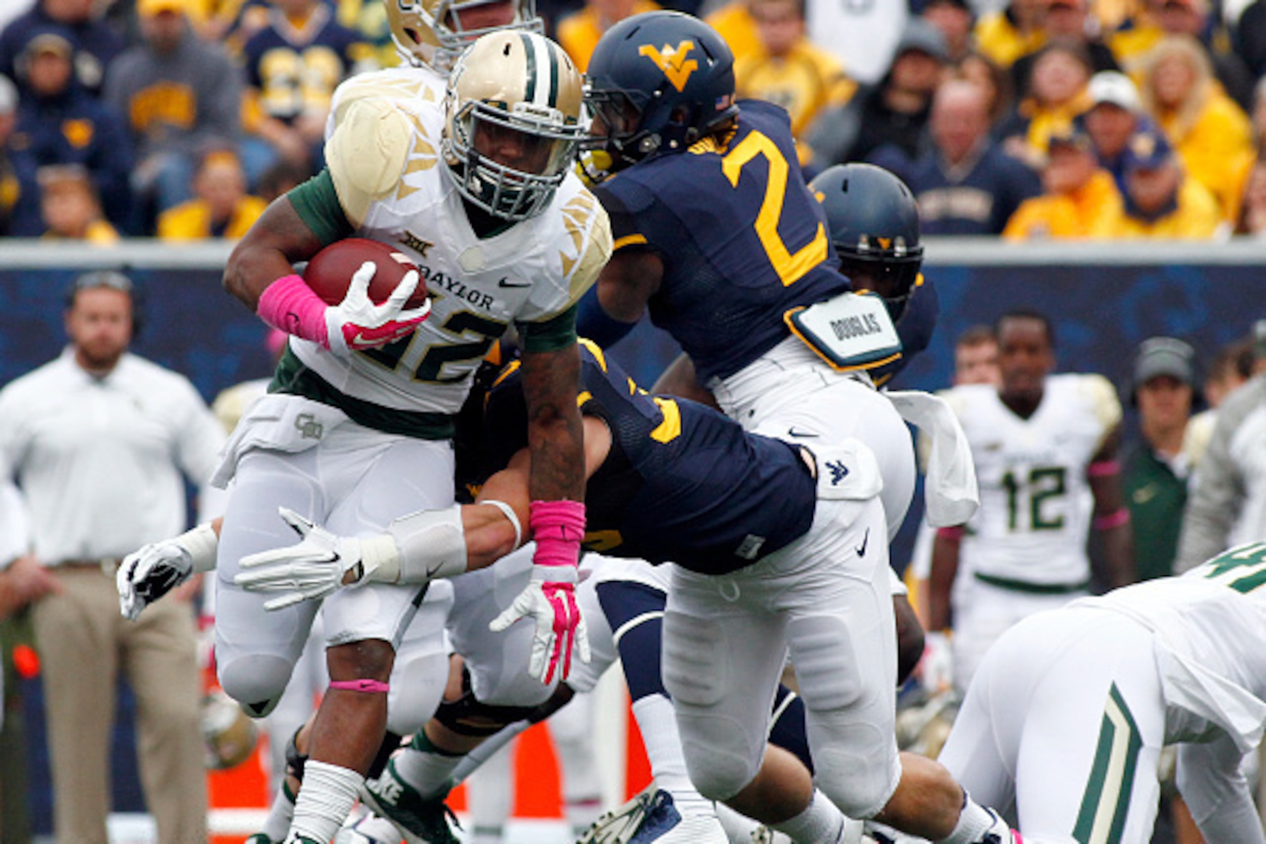 MORGANTOWN, WV - OCTOBER 18: Shock Linwood #32 of the Baylor Bears rushes in the first half against the West Virginia Mountaineers during the game on October 18, 2014 at Mountaineer Field in Morgantown, West Virginia. (Photo by Justin K. Aller/Getty Ima MORGANTOWN, WV - OCTOBER 18: Shock Linwood #32 of the Baylor Bears rushes in the first half against the West Virginia Mountaineers during the game on October 18, 2014 at Mountaineer Field in Morgantown, West Virginia. (Photo by Justin K. Aller/Getty Ima