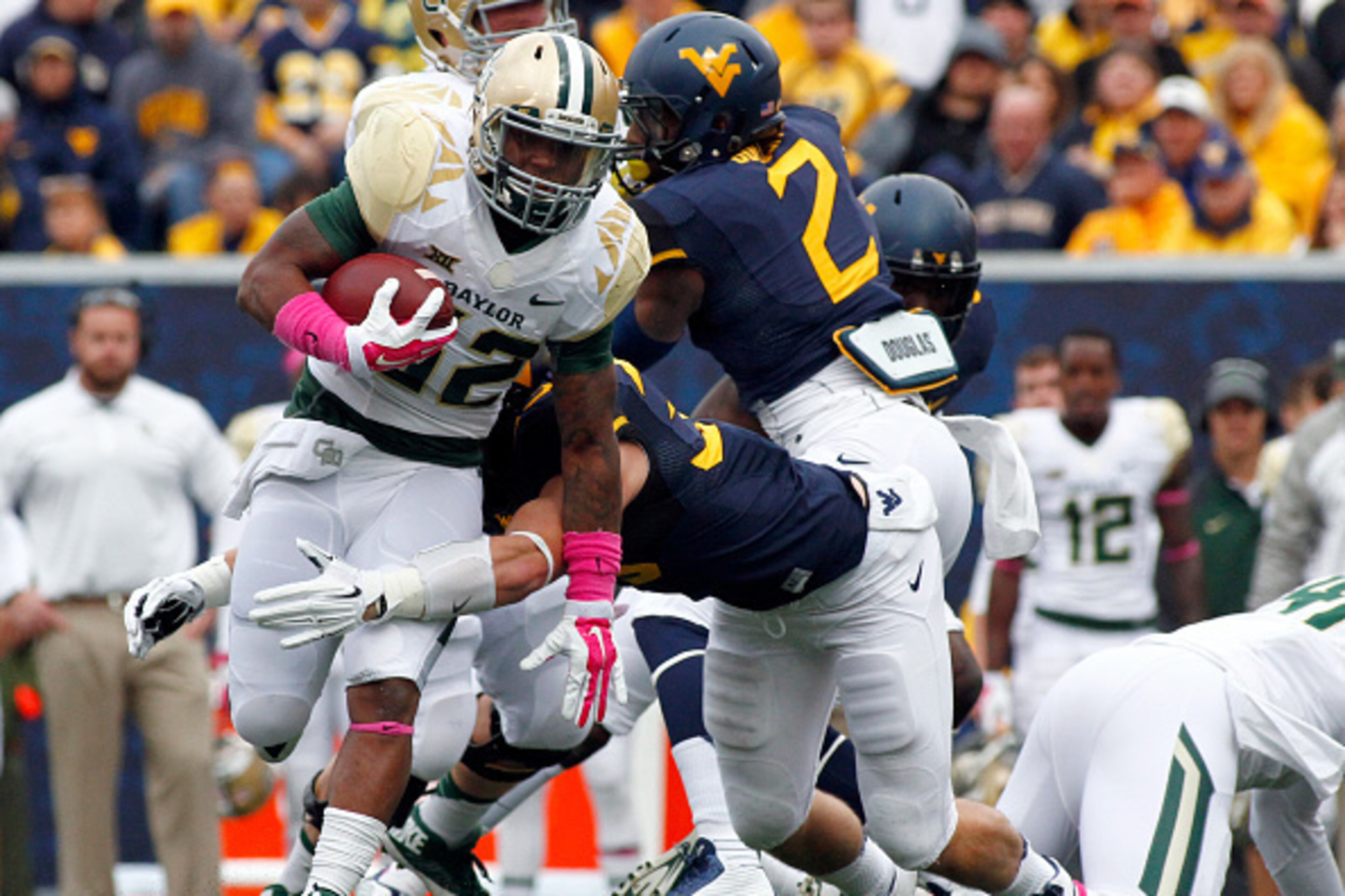 MORGANTOWN, WV - OCTOBER 18:  Shock Linwood #32 of the Baylor Bears rushes in the first half against the West Virginia Mountaineers during the game on October 18, 2014 at Mountaineer Field in Morgantown, West Virginia.  (Photo by Justin K. Aller/Getty Ima