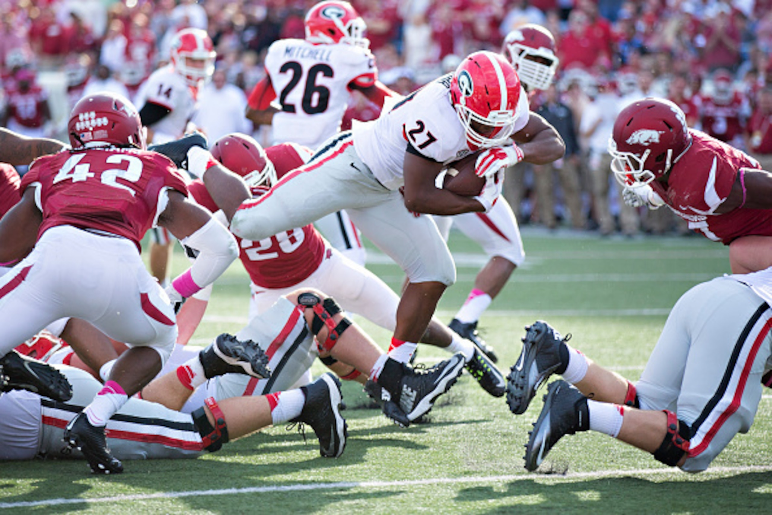 LITTLE ROCK, AR - OCTOBER 18:  Nick Chubb #27 of the Georgia Bulldogs rushes for a touchdown against the Arkansas Razorbacks at War Memorial Stadium on October 18, 2014 in Little Rock, Arkansas.  (Photo by Wesley Hitt/Getty Images)