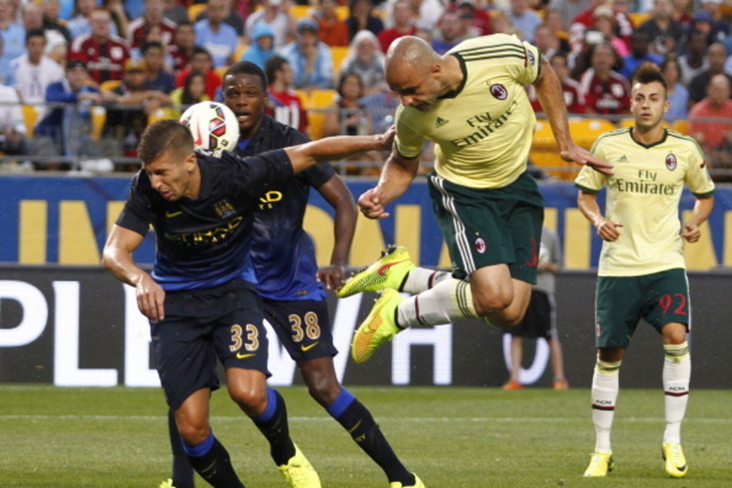 PITTSBURGH, PA - JULY 27:  Alex Rodrigo Dias da Costa #33 of AC Milan heads a ball in the first half against Matija NastasiÄ #33 of Manchester City during International Champions Cup 2014 at Heinz Field on July 27, 2014 in Pittsburgh, Pennsylvania.  (Phot
