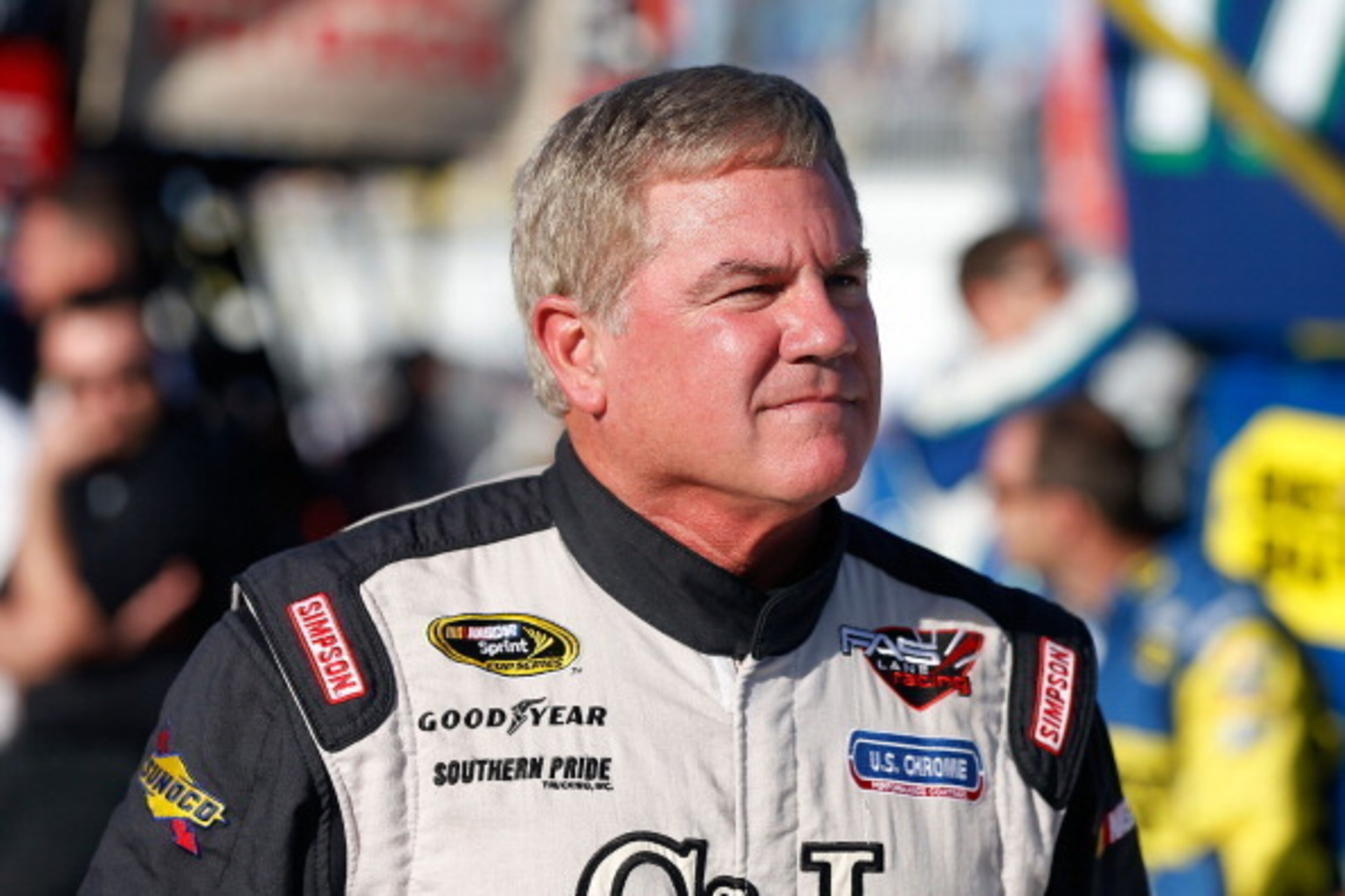 DAYTONA BEACH, FL - JULY 06: Terry Labonte driver of the #32 C&J Energy Ford, stands on pit road before the start of the NASCAR Sprint Cup Series Coke Zero 400 at Daytona International Speedway on July 6, 2013 in Daytona Beach, Florida.  (Photo by Scott H