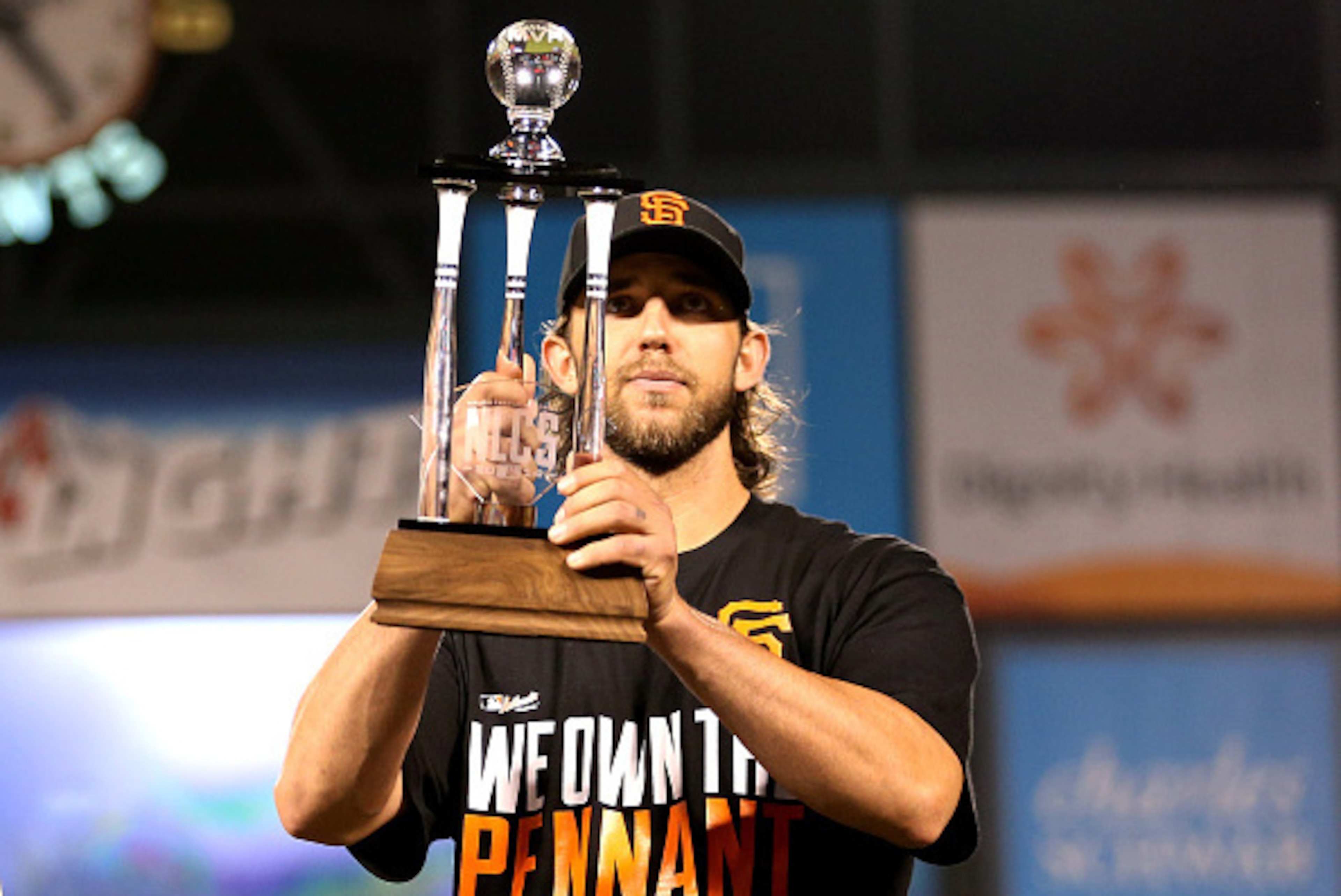 SAN FRANCISCO, CA - OCTOBER 16:  Madison Bumgarner #40 of the San Francisco Giants holds up the NLCS MVP award after the Giants defeat the St. Louis Cardinals 6-3 during Game Five of the National League Championship Series at AT&T Park on October 16, 2014