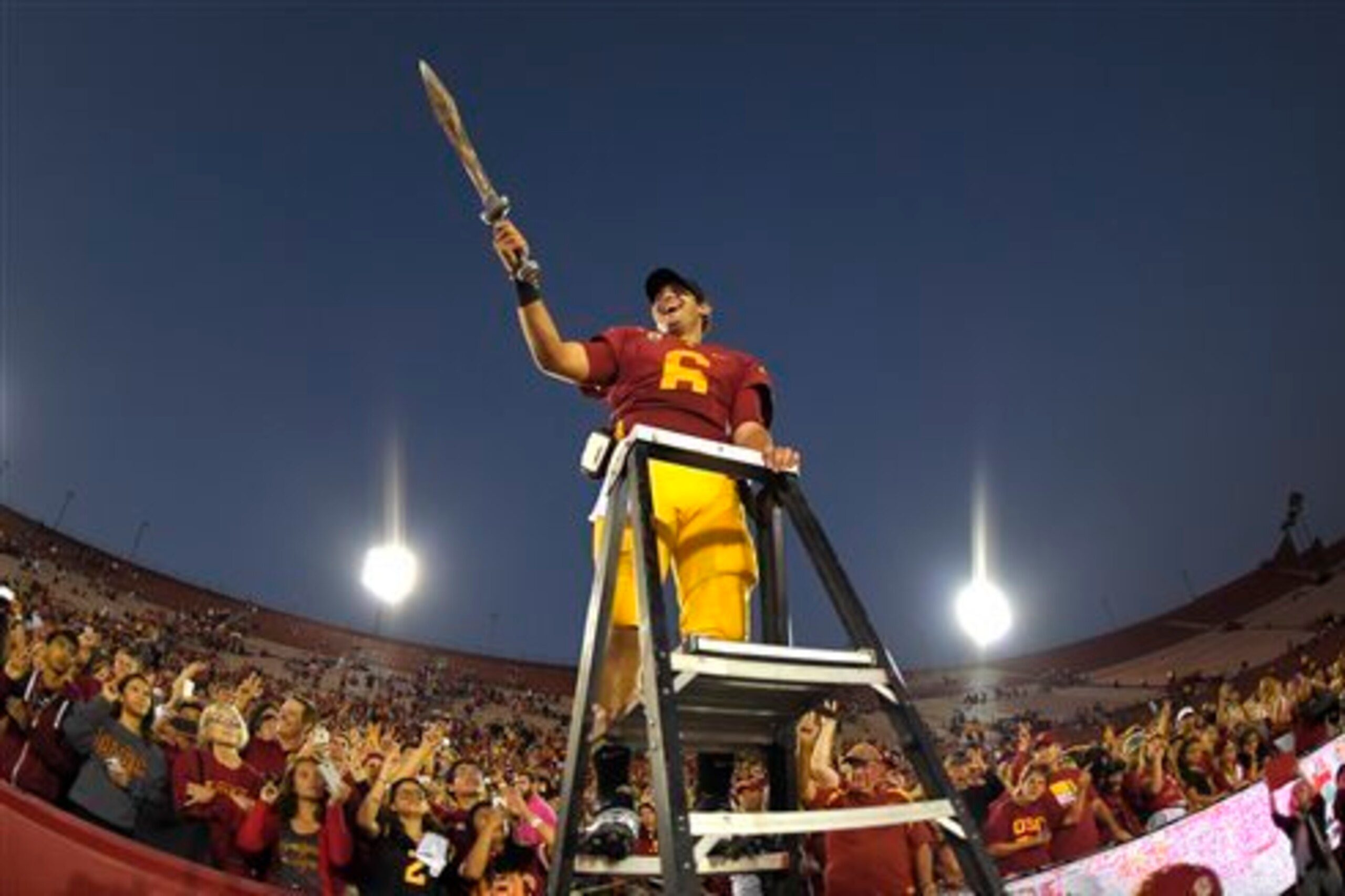 Cody Kessler leads the USC band after throwing a program record seven touchdown passes.