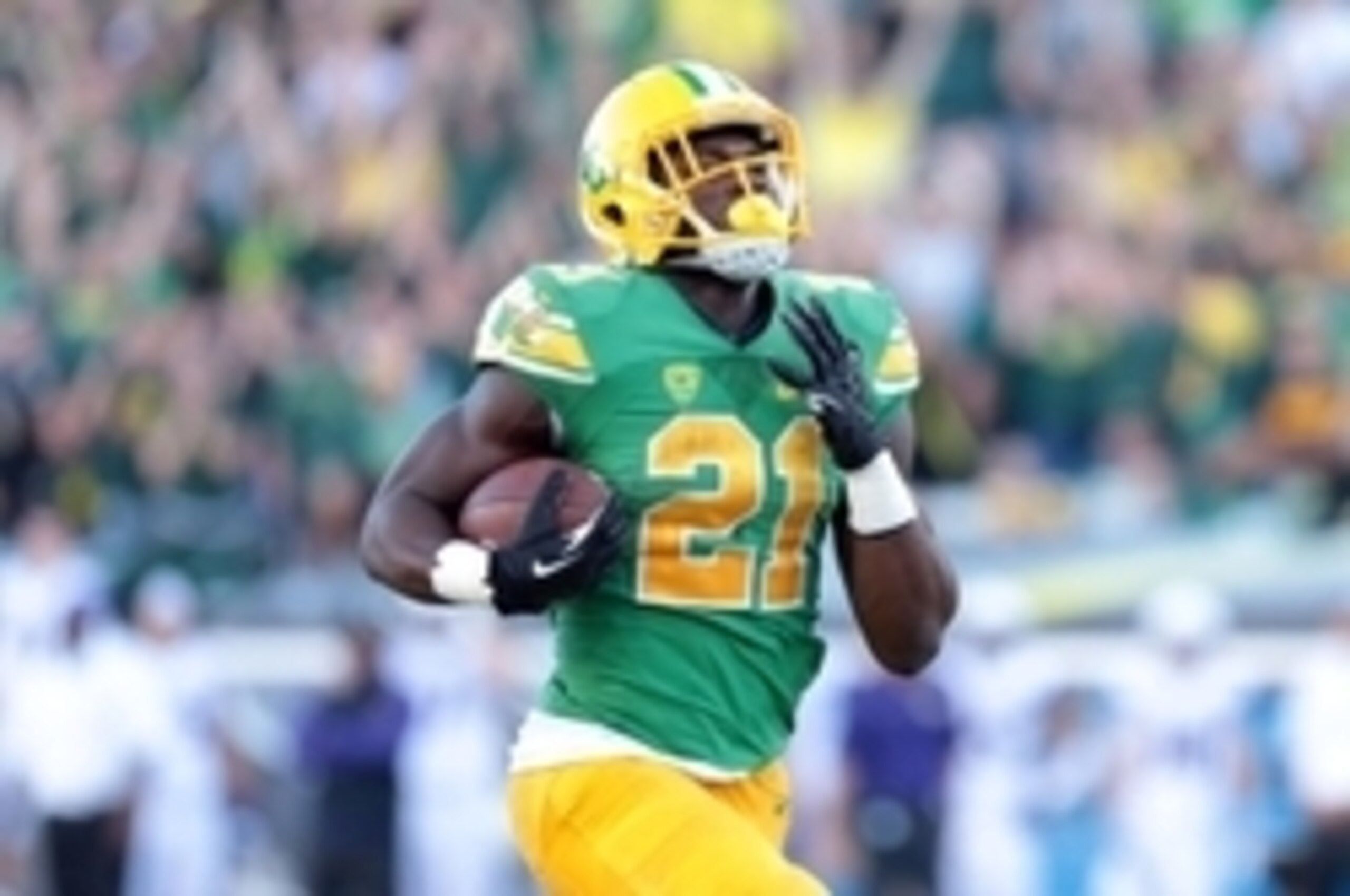 Oct 18, 2014; Eugene, OR, USA; Oregon Ducks running back Royce Freeman (21) runs the ball for a touchdown against the Washington Huskies at Autzen Stadium. Mandatory Credit: Scott Olmos-USA TODAY Sport