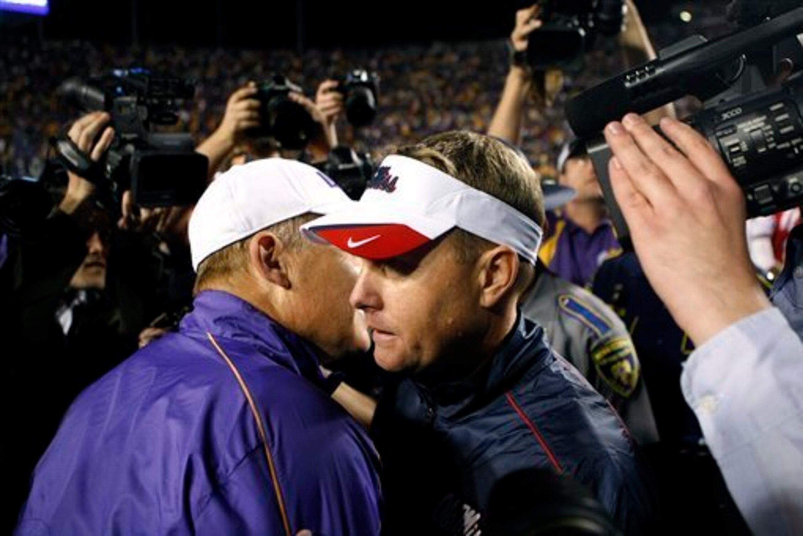 LSU head coach Les Miles (left) and Hugh Freeze (right)