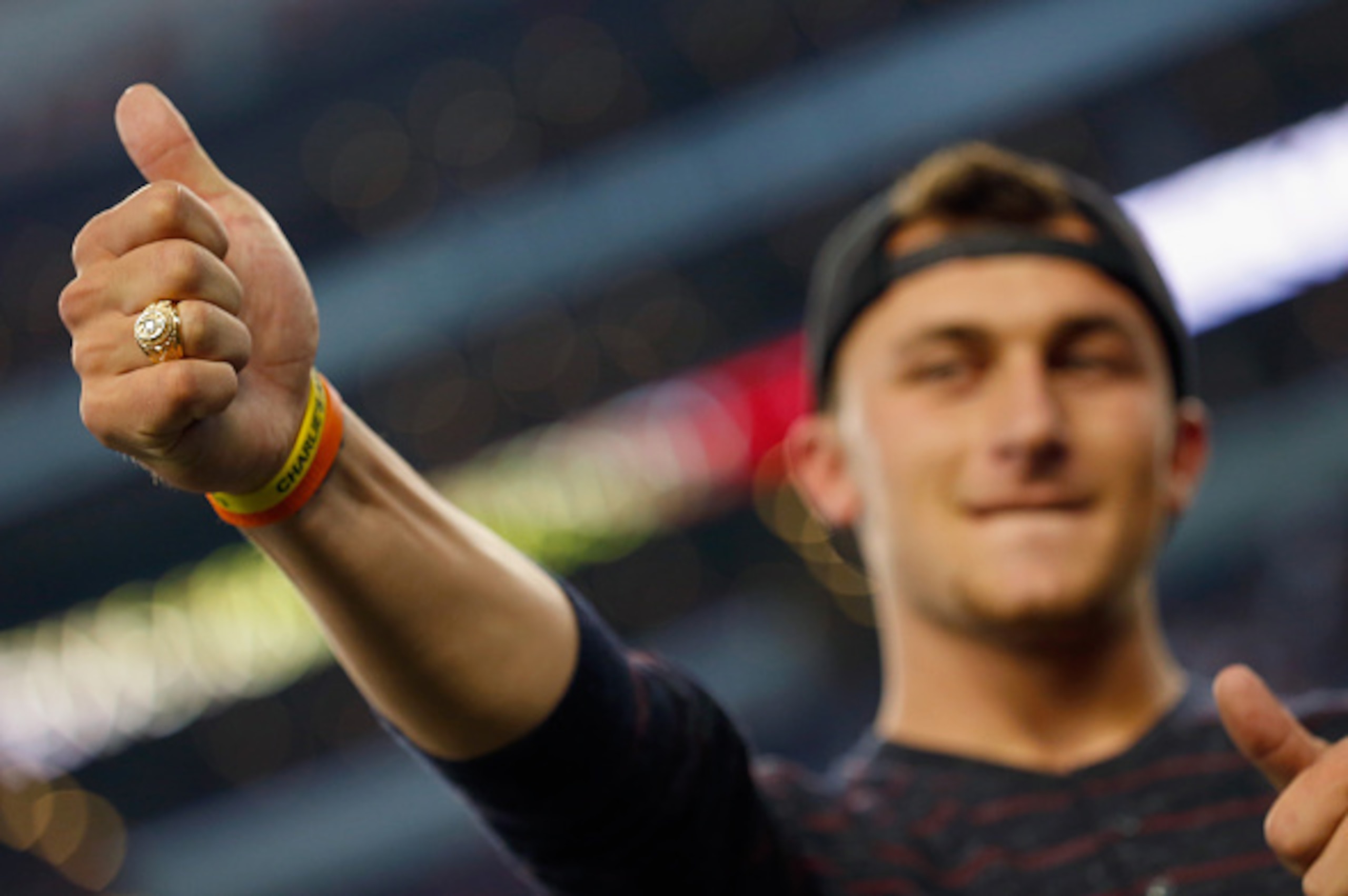 ARLINGTON, TX - SEPTEMBER 27:  Johnny Manziel #2 of the Cleveland Browns reacts after receiving his Aggie Ring during half time of the Southwest Classic at AT&T Stadium on September 27, 2014 in Arlington, Texas.  (Photo by Tom Pennington/Getty Images)