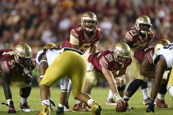 TALLAHASSEE, FL - OCTOBER 18:  Jameis Winston #5 of the Florida State Seminoles calls a play against the Notre Dame Fighting Irish during their game at Doak Campbell Stadium on October 18, 2014 in Tallahassee, Florida.  (Photo by Streeter Lecka/Getty Imag