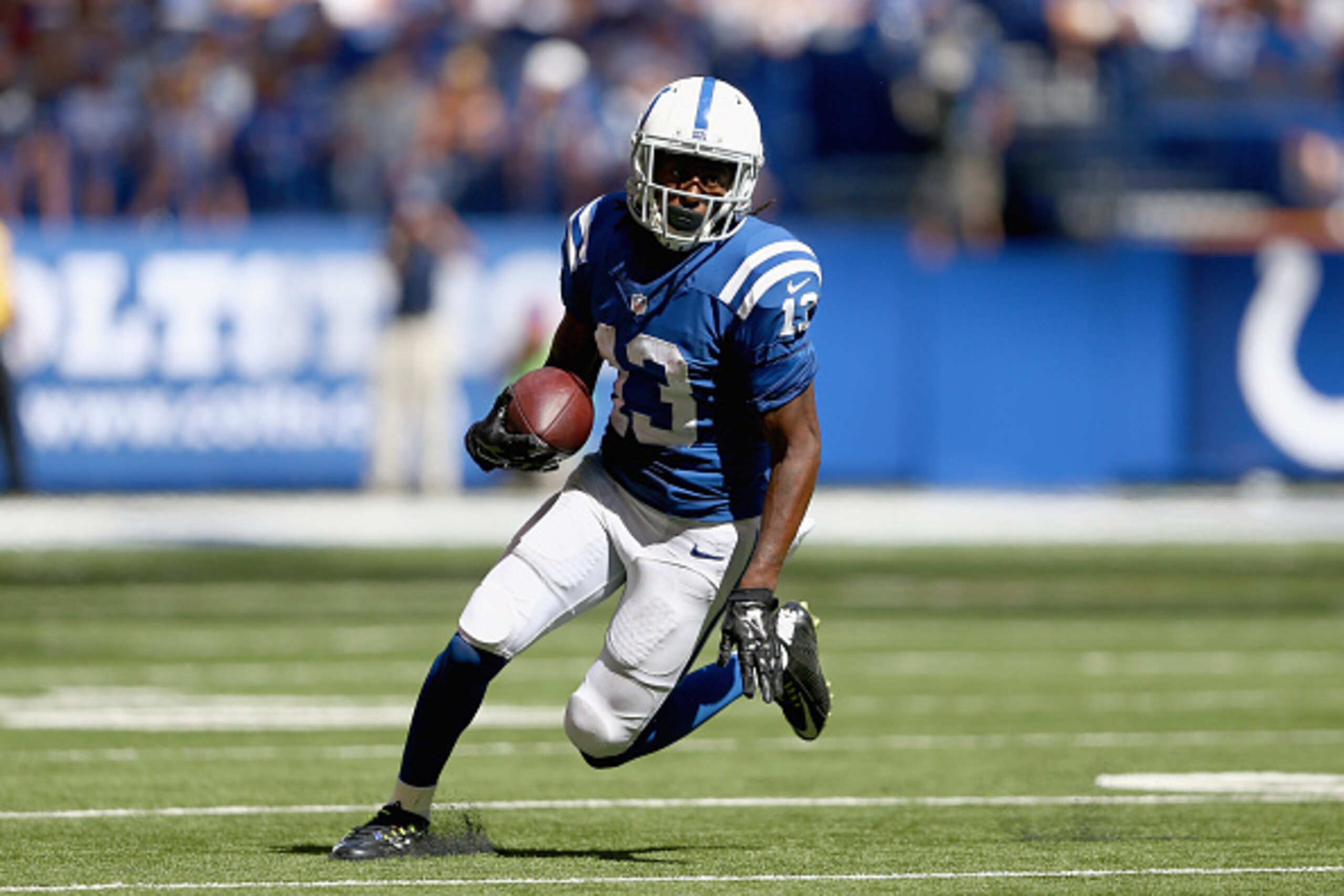 INDIANAPOLIS, IN - SEPTEMBER 28:   T.Y. Hilton #13  of the Indianapolis Colts runs with the ball during the game against the Tennessee Titans at Lucas Oil Stadium on September 28, 2014 in Indianapolis, Indiana.  (Photo by Andy Lyons/Getty Images)