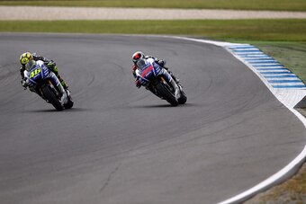 PHILLIP ISLAND, AUSTRALIA - OCTOBER 19:  Valentino Rossi of Italy and riding the #46 Movistar Yamaha MotoGp Yamaha leads Jorge Lorenzo of Spain riding the #99 Movistar Yamaha MotoGp Yamaha during the 2014 MotoGP of Australia at Phillip Island Grand Prix C