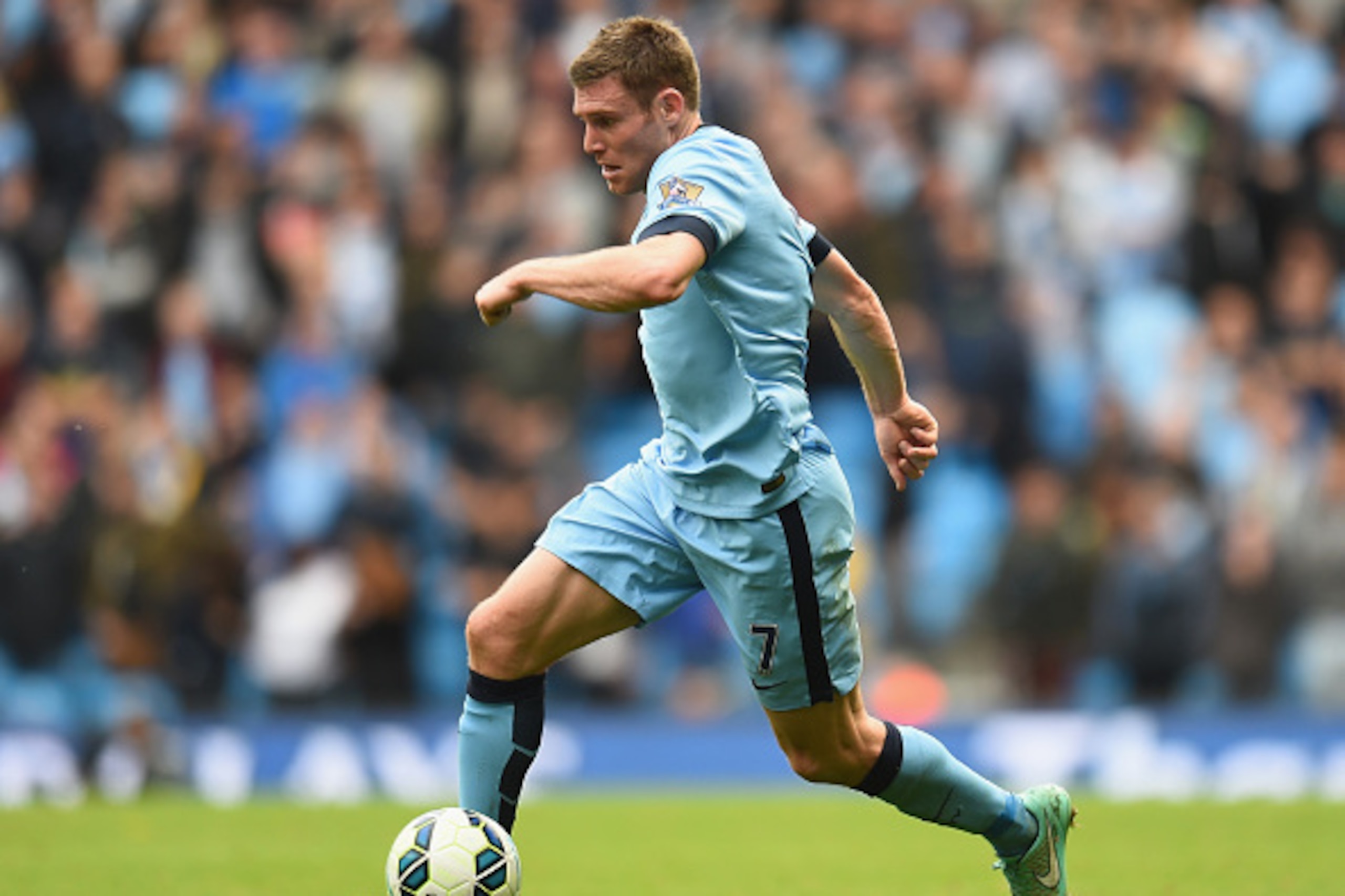 MANCHESTER, ENGLAND - OCTOBER 18:  James Milner of Manchester City in action during the Barclays Premier League match between Manchester City and Tottenham Hotspur at Etihad Stadium on October 18, 2014 in Manchester, England.  (Photo by Shaun Botterill/Ge